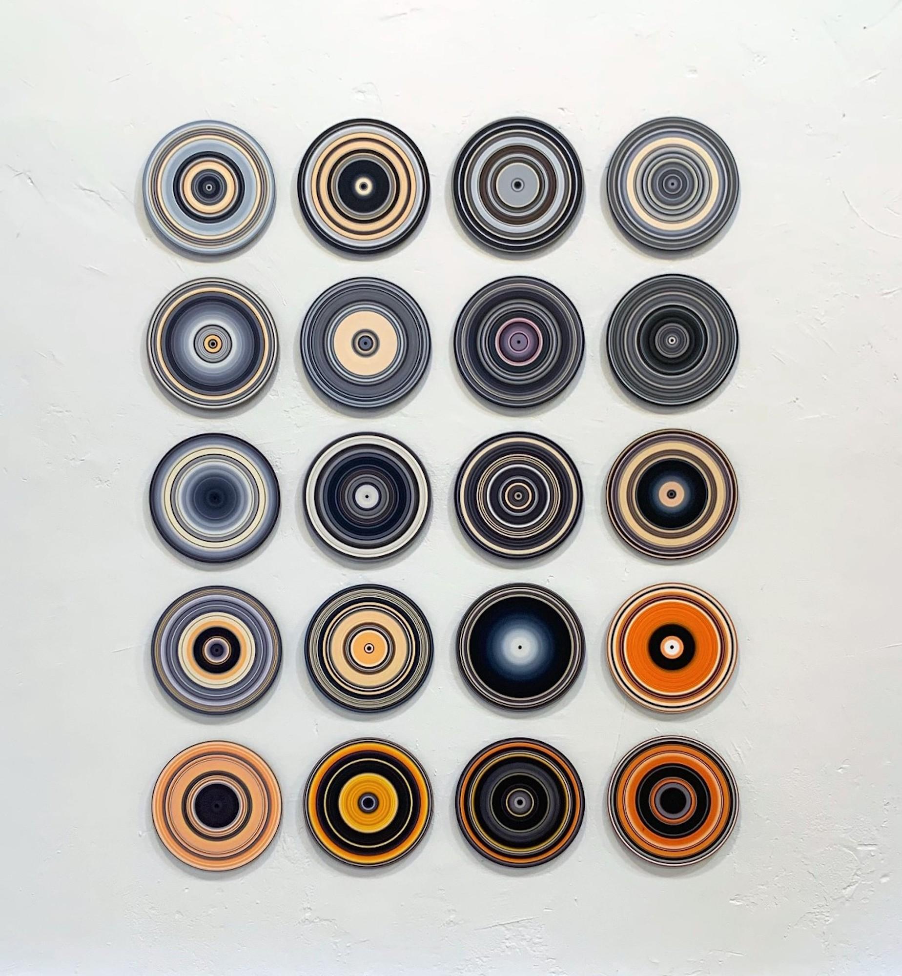 SOUND AND VISION – BlackWhiteOrange (Volume II) is a unique oil on vinyl installation by German contemporary artist Doris Marten, dimensions are 170 × 135 cm (66.9 × 53.1 in). Every piece is 30 cm in diameter (11.8 in).
The artwork is signed, sold