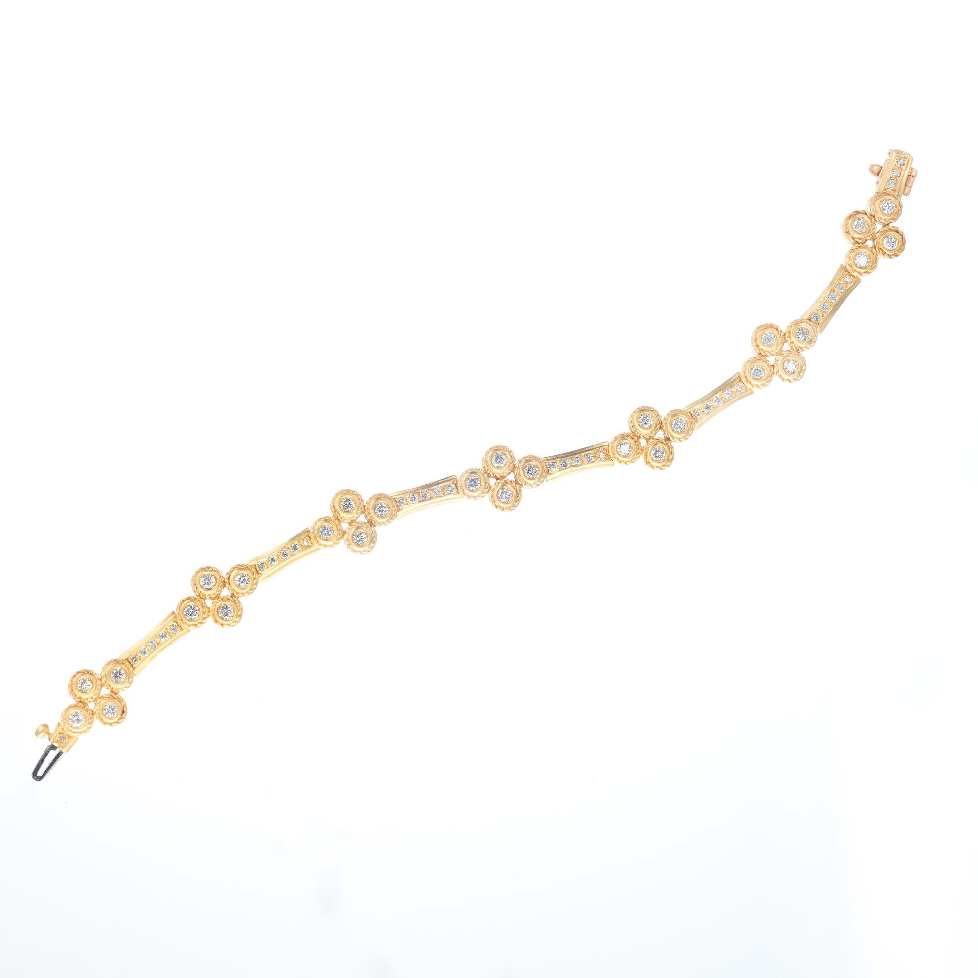 Doris Panos 18k yellow gold diamond flower motif bracelet. Soft texture finish, sparkly full cut diamonds. Built in safety catch. 

62 round brilliant cut G VS diamonds, Approximate 1.40cts 
18k yellow gold
Stamped: 18k
Hallmark: DP C2000
37