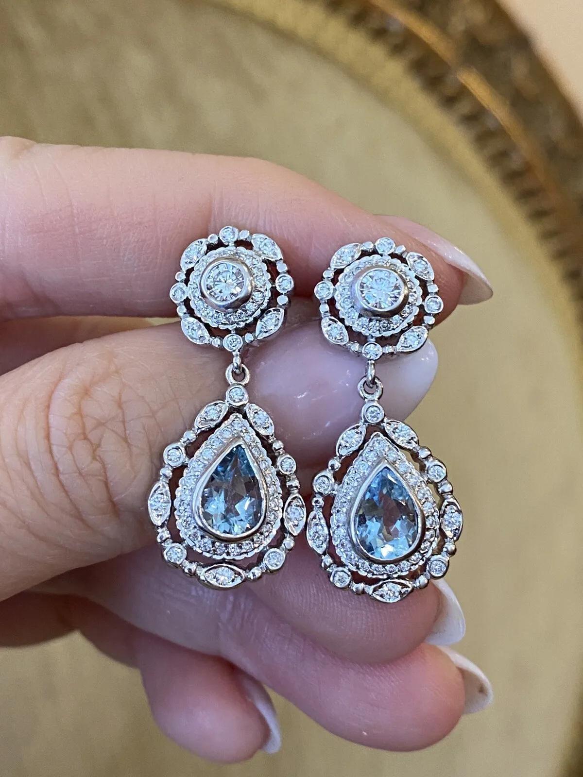 DORIS PANOS Aquamarine and Diamond Drop Earrings in 18k White Gold

Aquamarine and Diamond Drop Earrings feature a Pear shaped Aquamarine in the center accented by Round Brilliant Diamonds in 18k White Gold by Doris Panos.

Total Diamond weight is