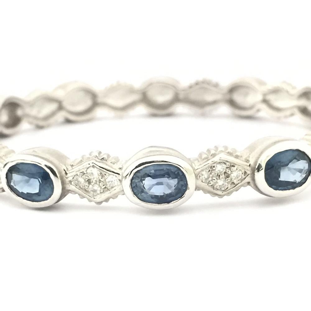 Doris Panos Blue Sapphire and Diamonds Bangle in 18k White Gold 
Oval Blue Sapphire 6.65 carat total weight 
Diamonds 0.40 carat total weight 
BR607SA 