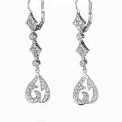 Orecchini Doris Panos con diamante rotondo e goccia in oro