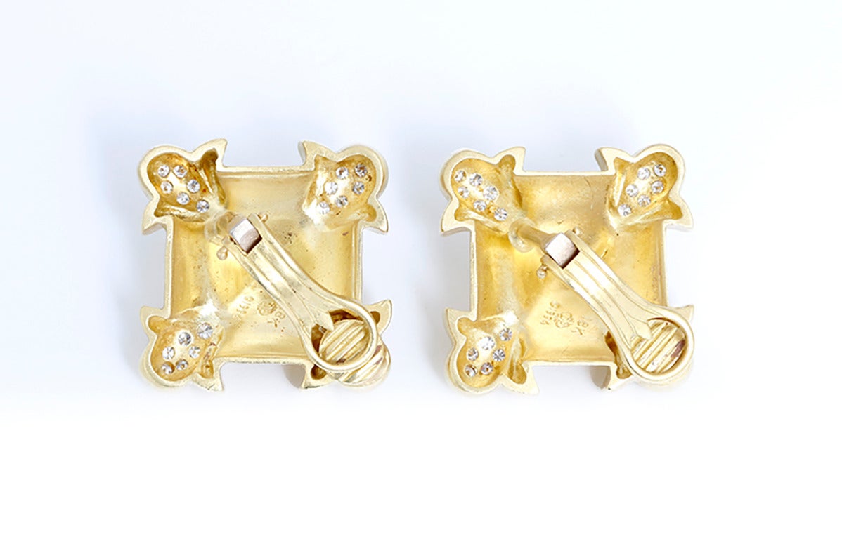 These  earrings measure apx. 1-in. x 1-in. There are 6 diamonds on each corner. Clarity: VS, Color, G. Earrings are marked: DP, 1994, 18K. Total weight is 34.0g.