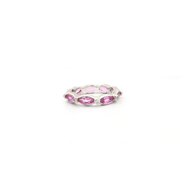 Doris Panos Pink Sapphire and Diamond Eternity Band in 18k White Gold 
Marquise Pink Sapphire 2.25 carat total weight 
Diamonds 0.10 carat total weight 
Ring Size 6.5
R807PK