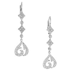 Orecchini Doris Panos con diamante rotondo e goccia in oro