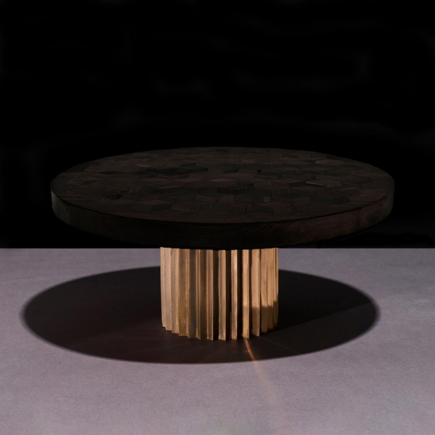 Dining or entrance table with marquetry top in ebonized Oak and multifaceted pedestal in cast bronze. 

The marquetry tabletop in reclaimed Oak contains 222 rhombi cut from old Italian wine barrels. Inspired by Doric columns in archaic architecture,