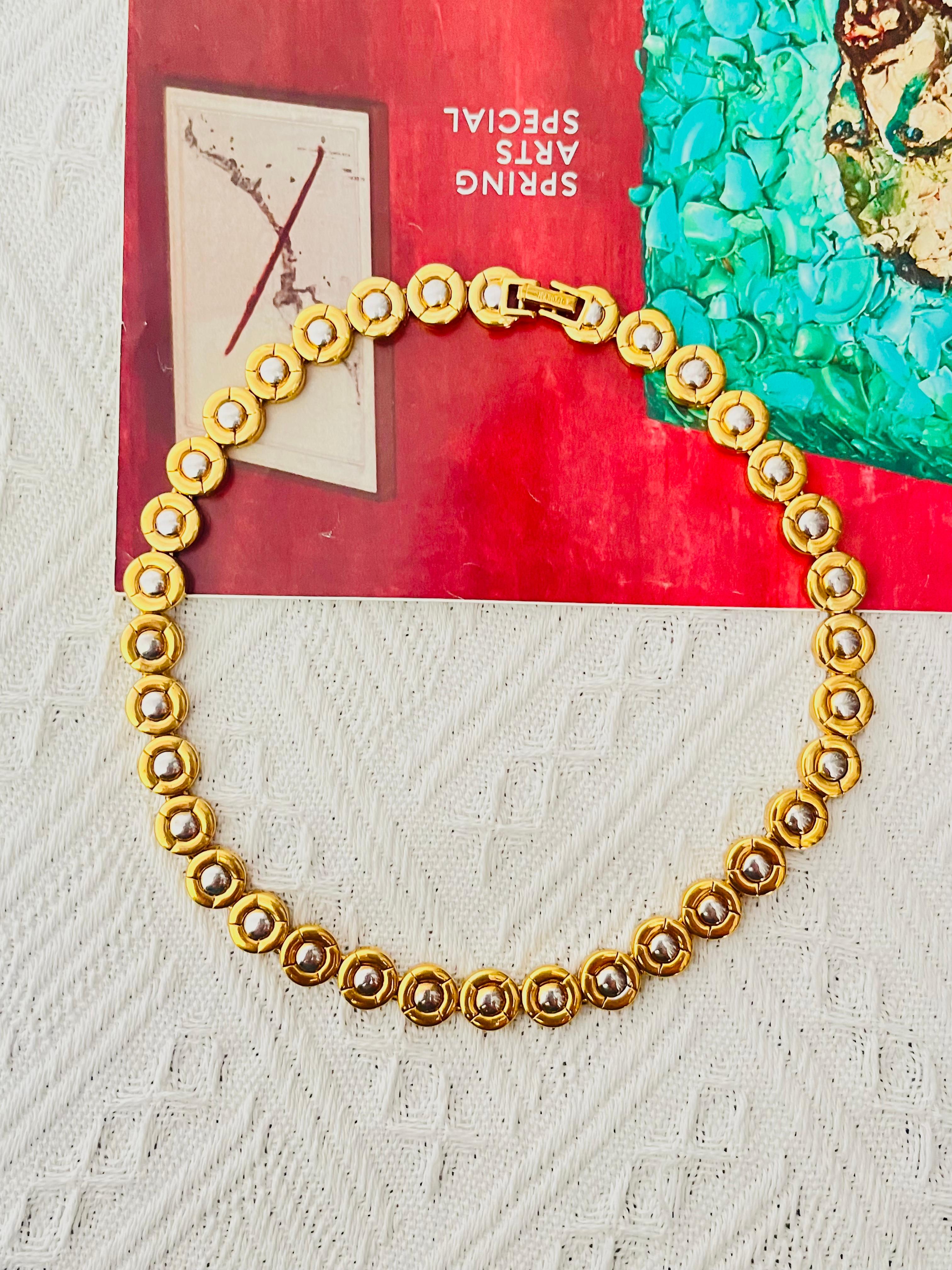 D'Orlan Vintage 1980s Unisex Tennis Beads Circle Round Dots Modernist Necklace, Silver Gold Tone 

Very good condition. 100% Genuine. Signed D'Orlan.

Material: Silver plated metal, Gold plated metal.

Size: 40*1.1 cm.

Weight: 64 g.

D'orlan was
