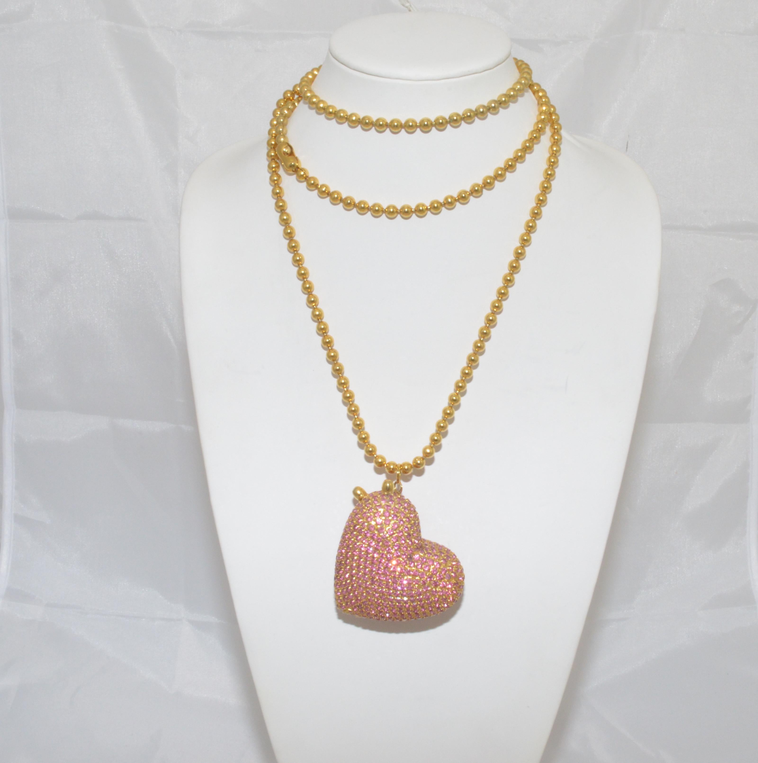 Dorothy Bauer Vintage Chain Necklace with Heart Locket Pendant -- Vintage necklace has a gold-tone bead chain with a large rhinestone-encrusted heart locket as a pendant. Marked ''pat 2007''

Length 50''