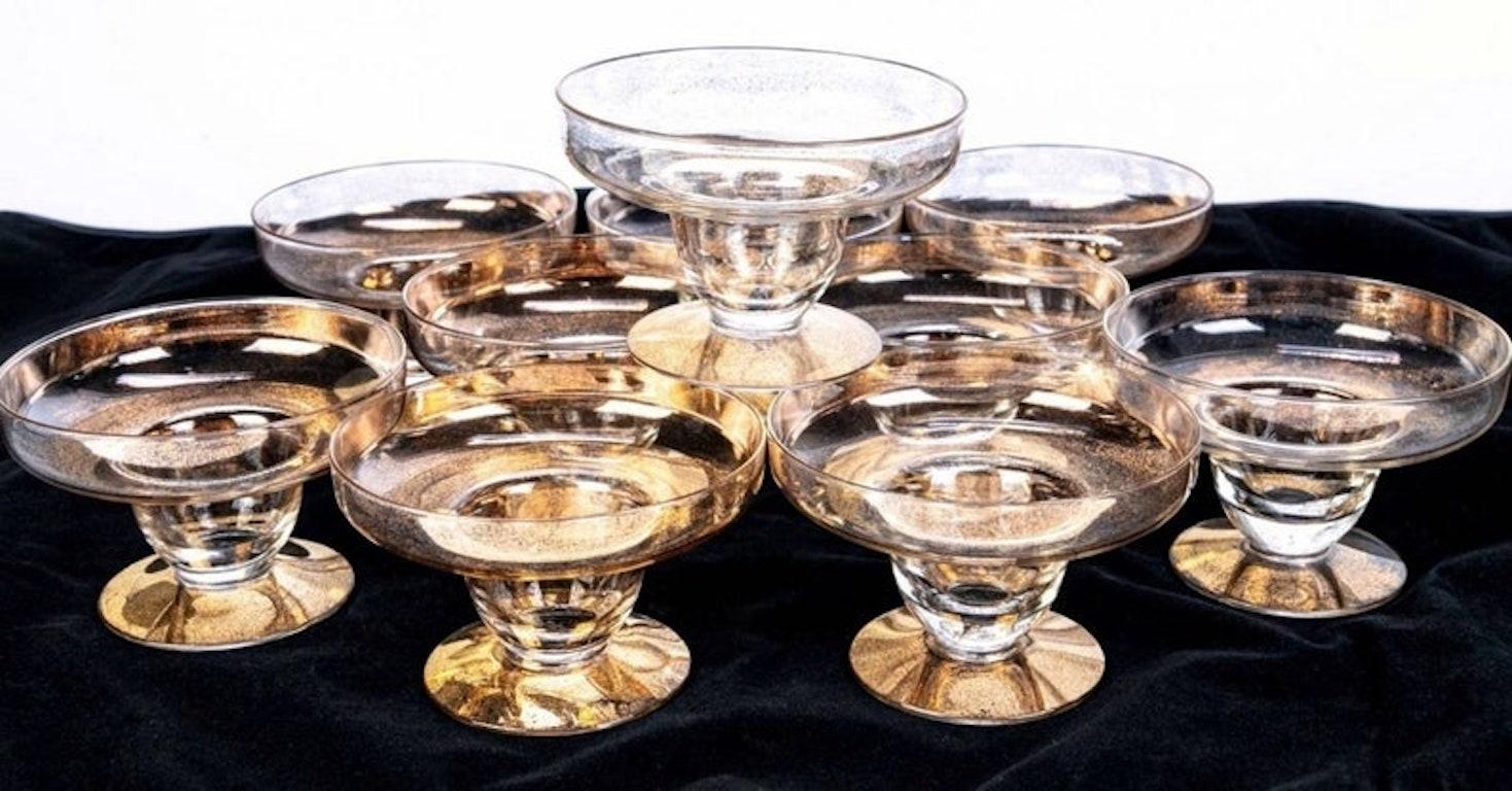 A fabulous set of ten exquisite Mid-Century Modern 22k gold gilt fleck embellished cocktail glasses designed by Dorothy C. Thorpe.

Elegant, sophisticated and glamorous, this beautiful, brilliantly shimmering serveware features a round bowl /