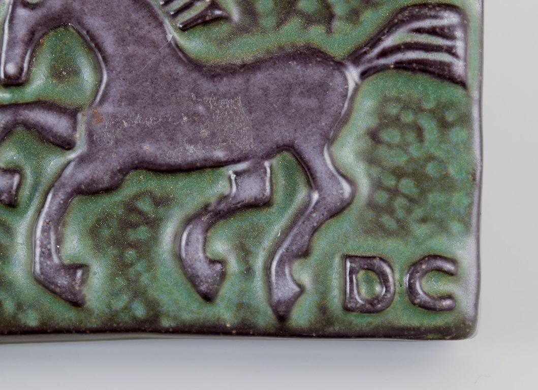 Swedish Dorothy Clough for Upsala-Ekeby. Wall relief in ceramic with motif of horses For Sale