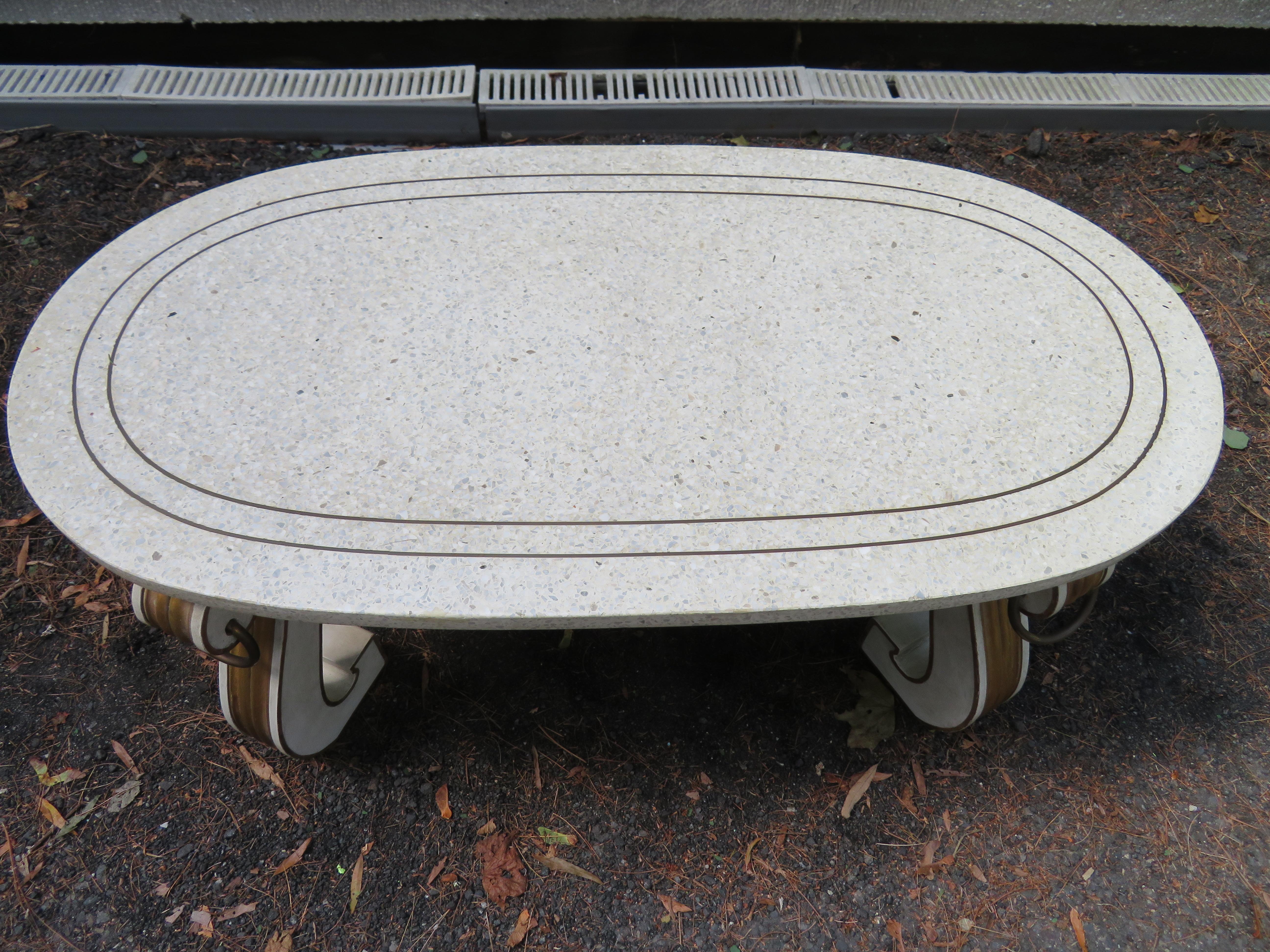Spectacular Dorothy Draper Espana collection terrazzo top coffee table. Just look at the wonderful removable racetrack terrazza top against the gilded gold detailed scrolled legs-stunning. We also love the brass ring detail on all the corners-so