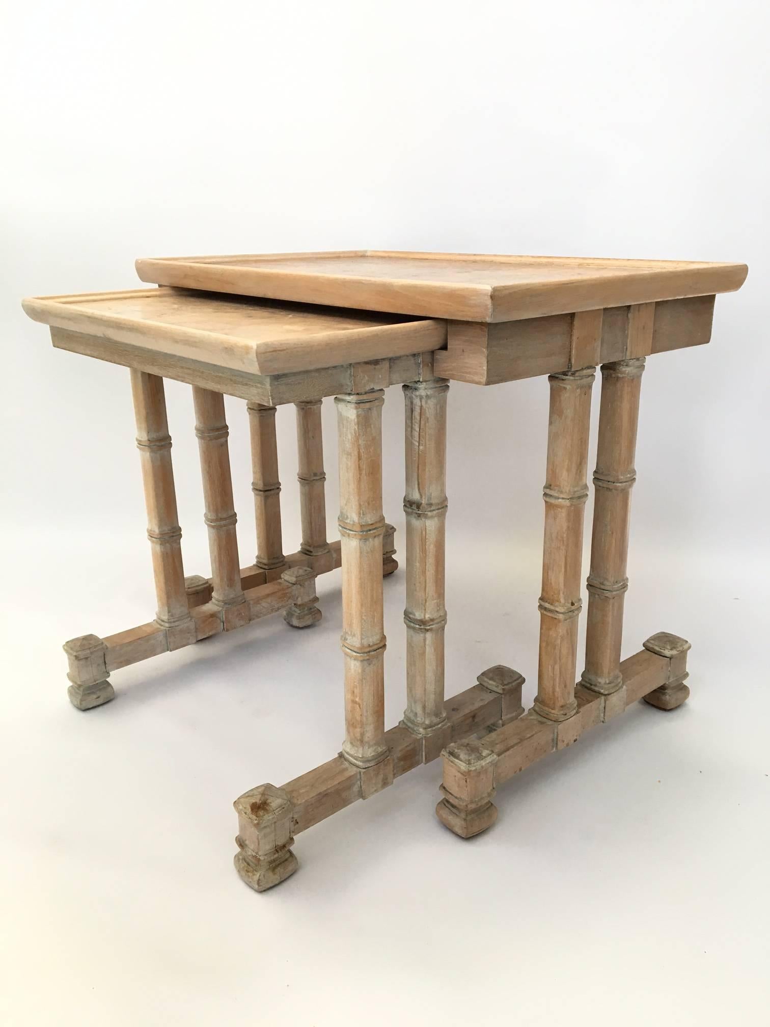 Pair of bamboo nesting tables by Dorothy Draper for Heritage. Solid wood construction. Structurally sound, with minor imperfections to the finish (see photos).
