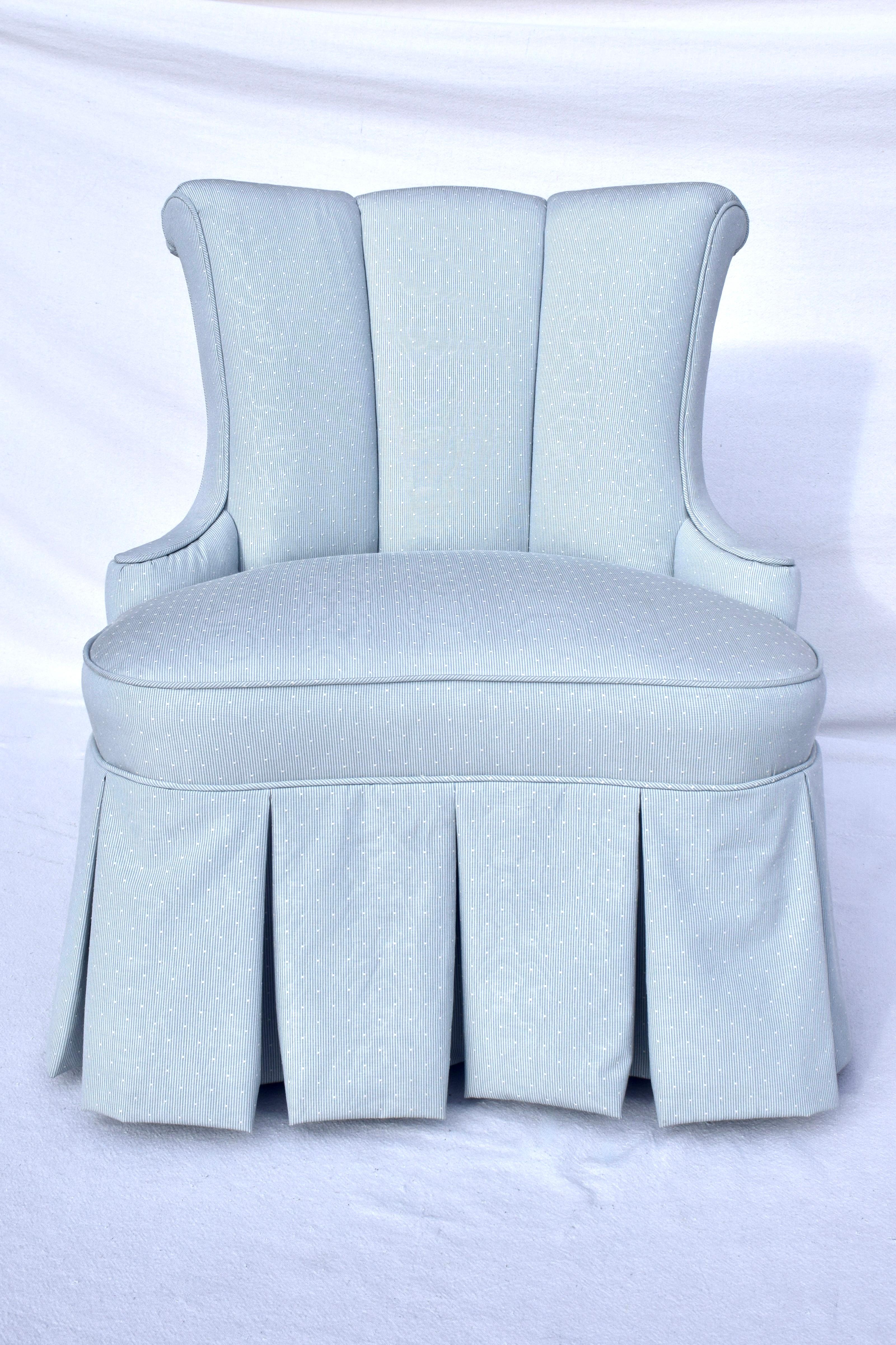 Mid 20th century Dorothy Draper Hollywood Regency channel back slipper chair with scroll details to the back & sides. Newly reupholstered in powder blue fabric with solidly maintained original spring construction, we love the box kick pleat skirt