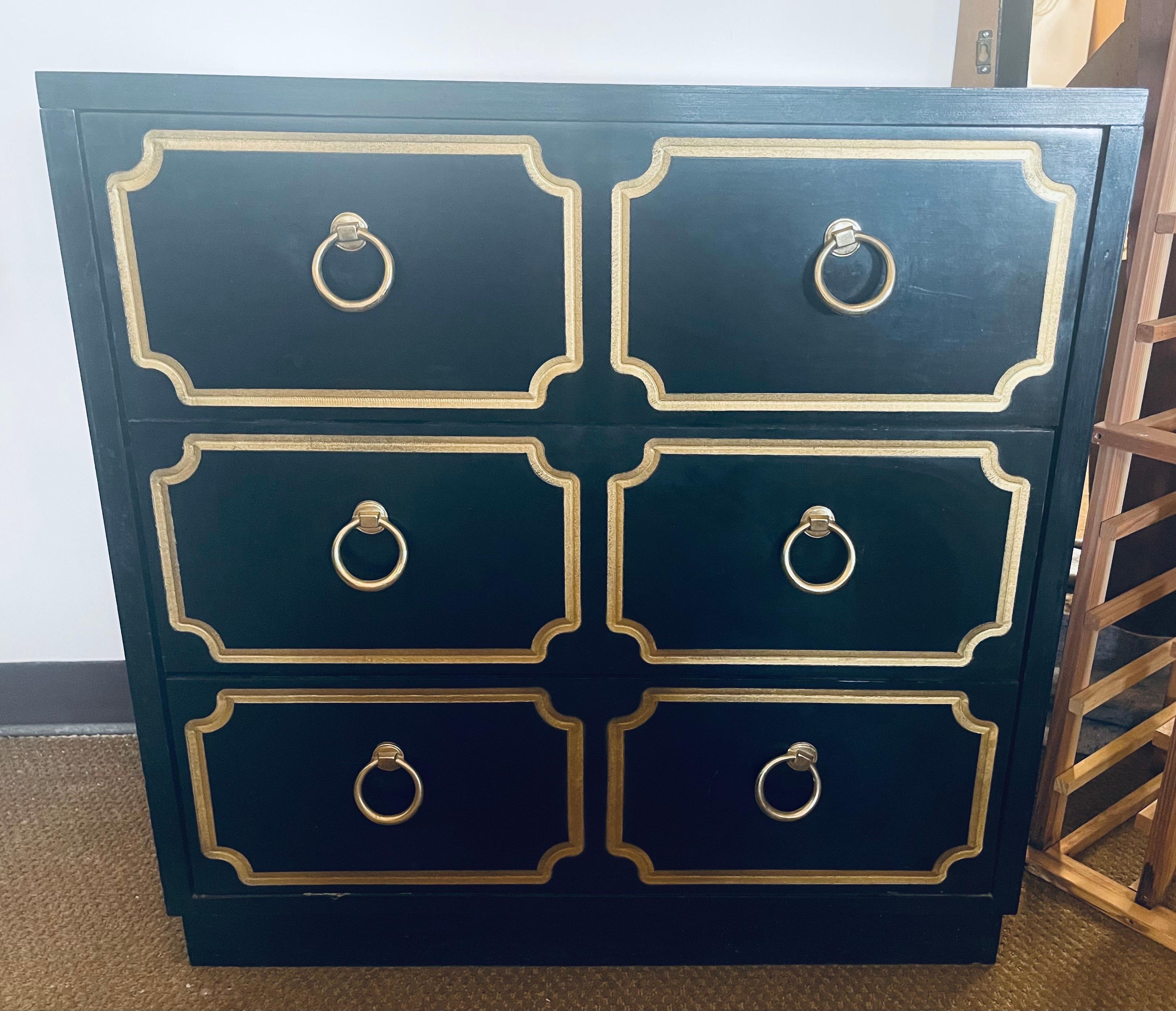 Rare Hollywood Regency chest of drawers - with three drawers and done in the style of the Heritage (Henredon) Espana line and from the same time period.  Features high gloss black and gold colors.  The thee drawers are large and the hardware