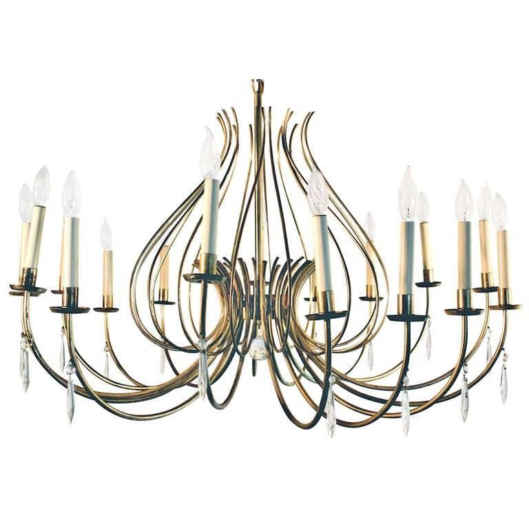 16 silver plated brass tubular arms. Crystals hang from each arm and from the center a crystal ball.  Reference the chandeliers in the Metropolitan Museum's Dorothy Draper Dining Room. Must be shipped white glove.