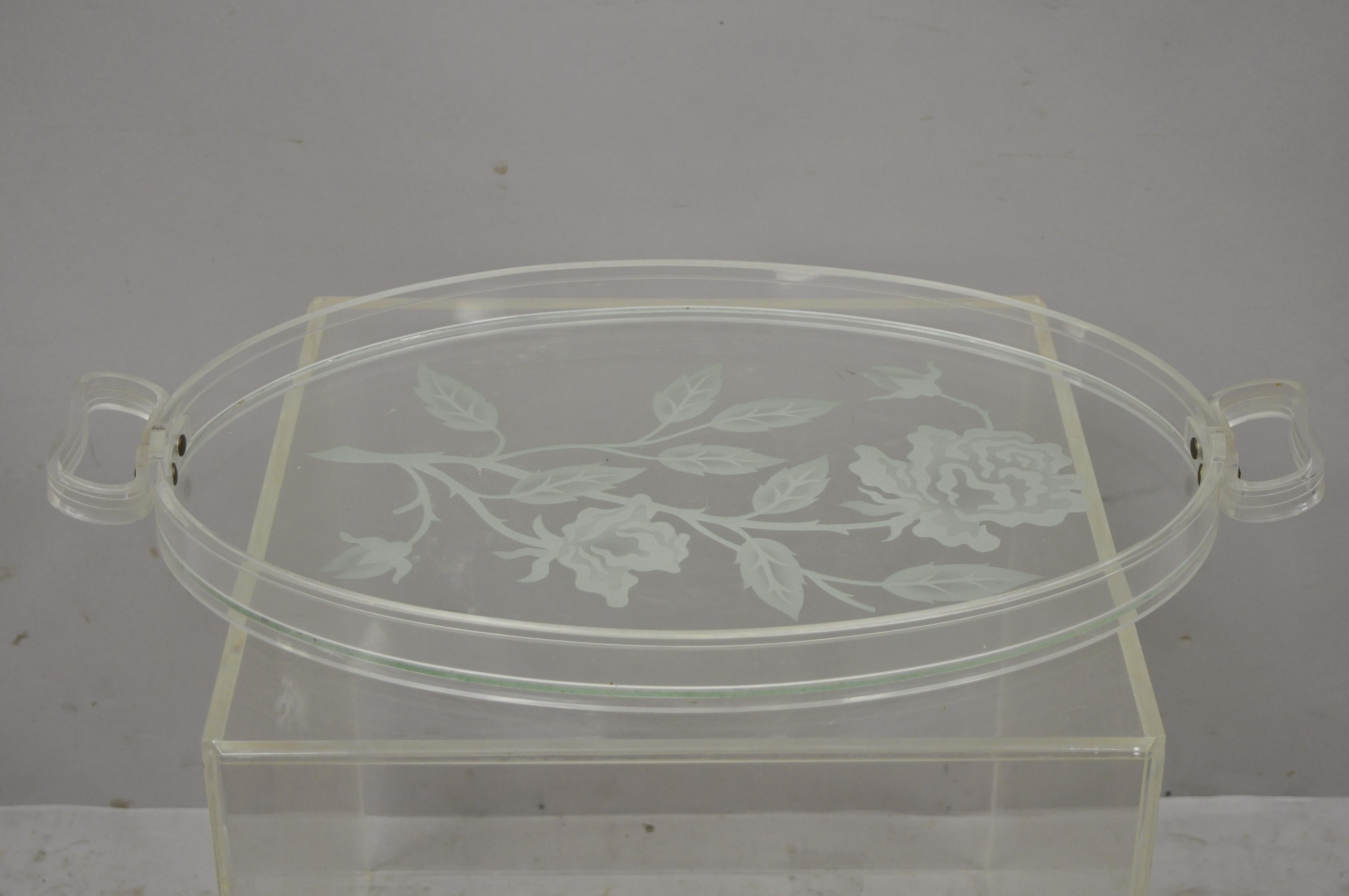 Dorothy Draper style Mid-Century Modern floral etched glass lucite serving tray platter. Item features floral etched glass tray, lucite/acrylic border/handles, great style and form, circa mid 20th century. Measurements: 1.75
