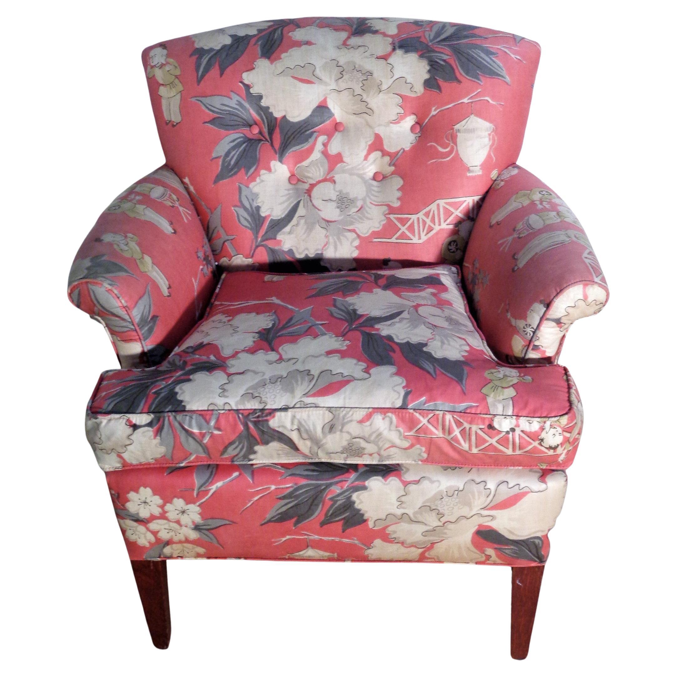 1940's Hollywood Regency armchair In the style of Dorothy Draper with tapered mahogany legs and button tufted polished cotton chinoiserie decorated fabric. Chair has been in one family since the 1940's. It is in all original vintage condition. Look