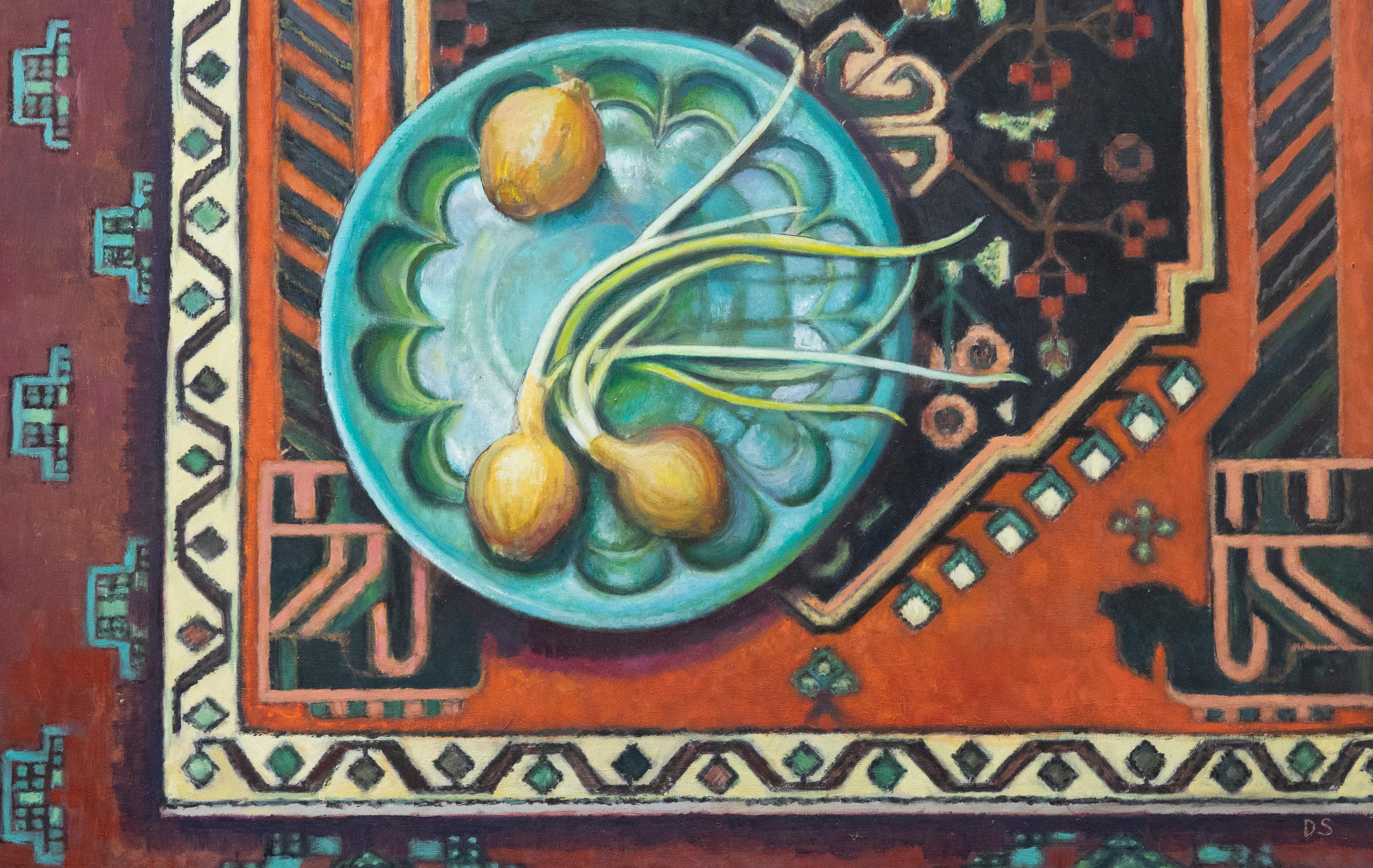 This accomplished still life study by Dorothy Southern depicts onions in a fluted turquoise bowl places on a large patterned kilim rug. The scene appears to take inspiration from the Bloomsbury group with a strong focus on colour, pattern and form.