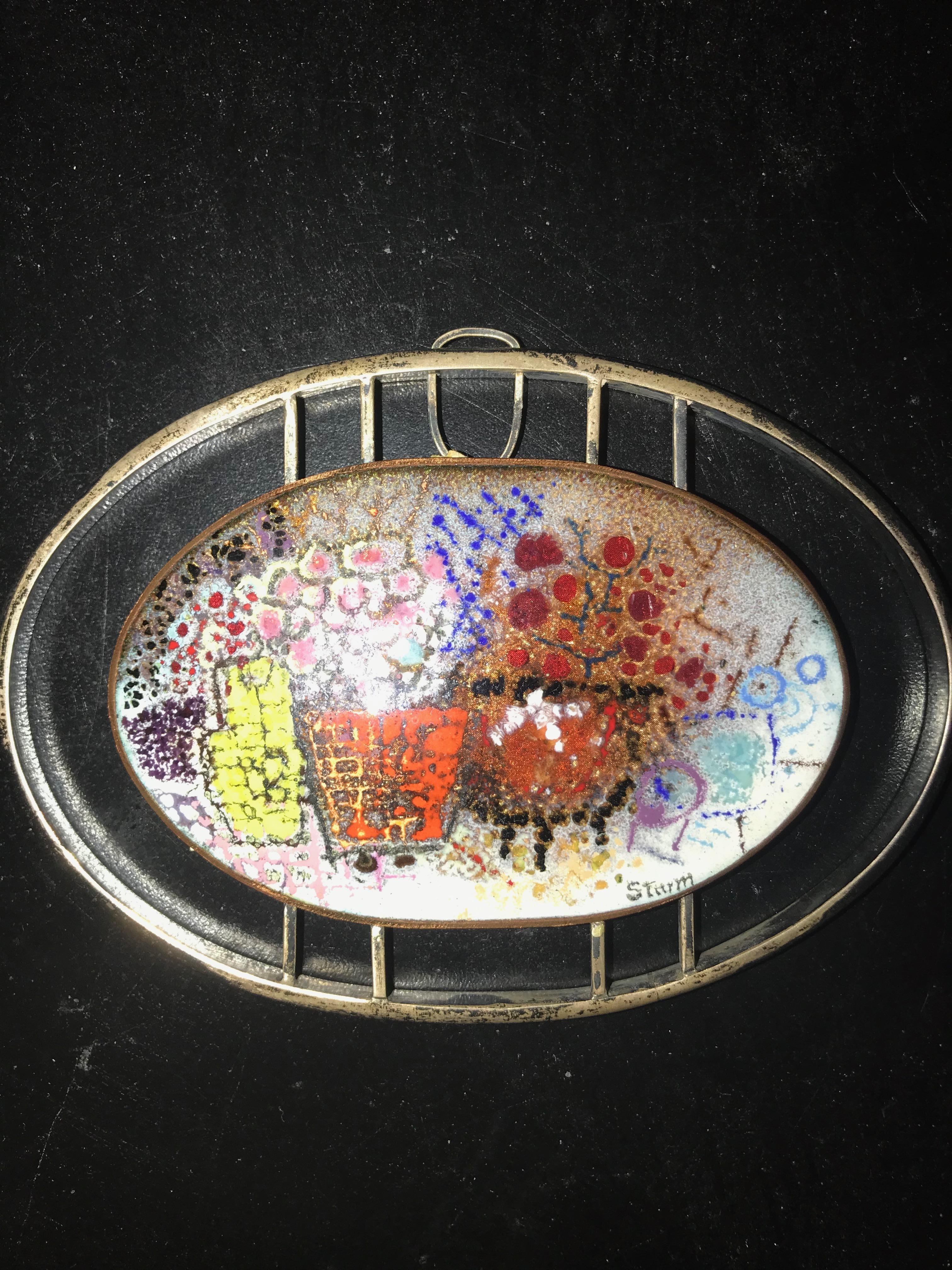 Enamel on Copper Pendant 

A small enamel similar to this one was shown in VOGUE Magazine in the early 1950s.
Jewelry by the artist is quite rare. There are two examples at the Metal Museum in Memphis shown on their website.

Dorothy Sturm