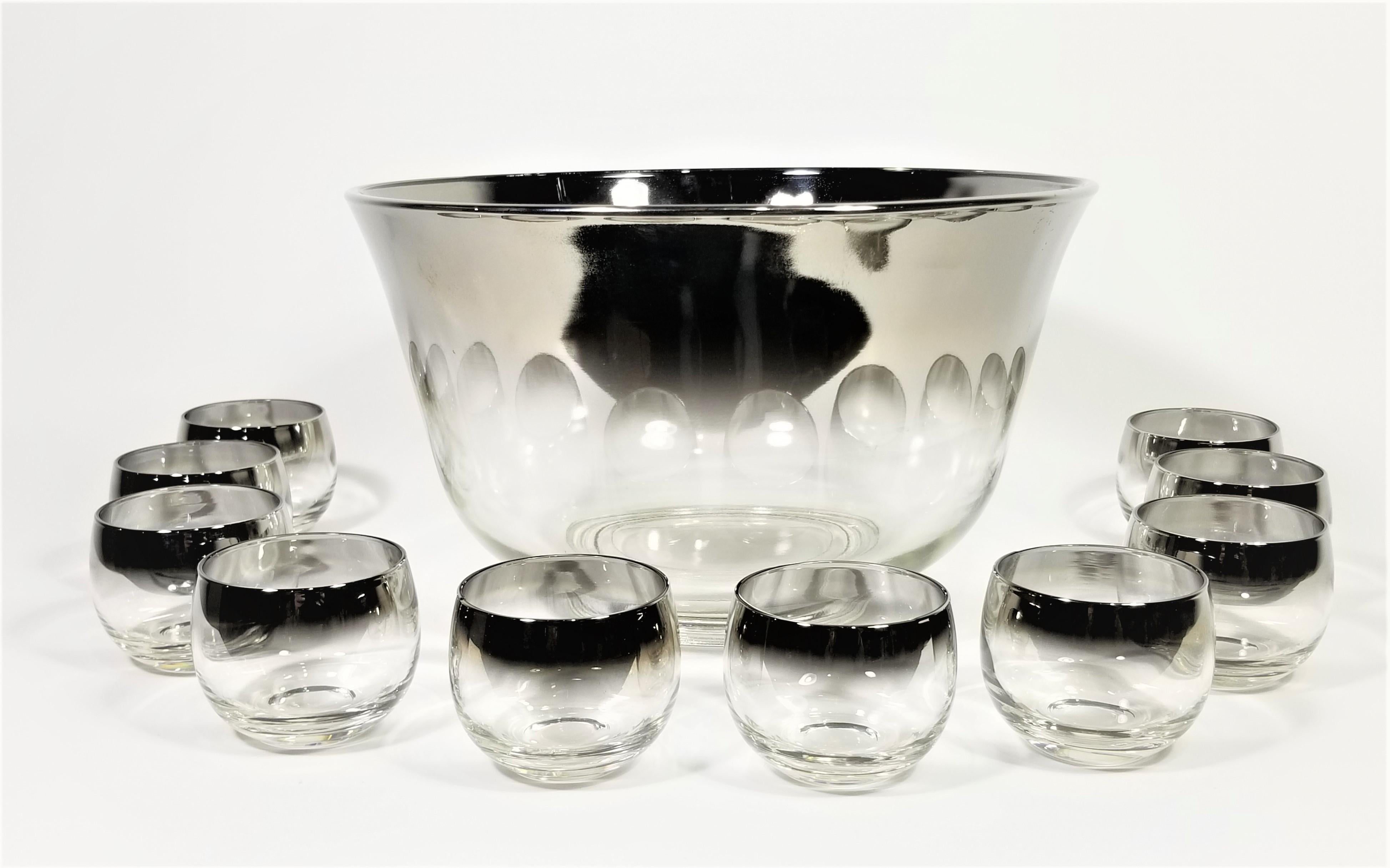 Mid Century 1960s Glassware Barware Set. Silver Fade Design. Glasses often referred as Roly Poly glasses due to their round modern shape. 1 Bowl and 10 glasses and 1 large serving spoon. 


Measurements:
Punch Bowl Height: 6.75 inches
Punch