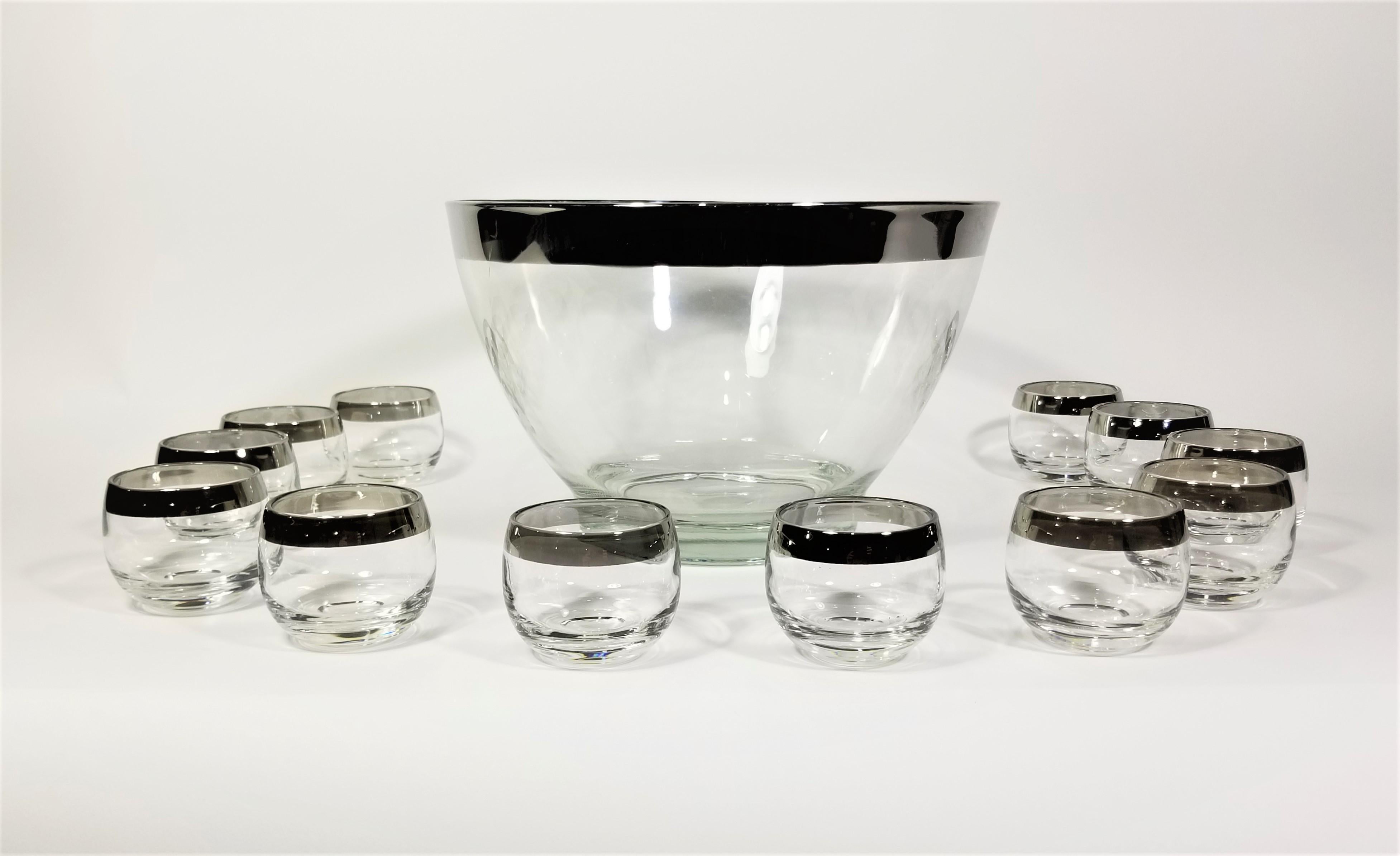 1960s Mid Century Dorothy Thorpe Silver Rimmed Glassware Barware. Punch Bowl with 12 4oz glasses. Glasses are often referred to as Roly Poly glasses due to their round modern shape. 
Entire set is in Excellent Condition. 

Measurements:
Bowl Height:
