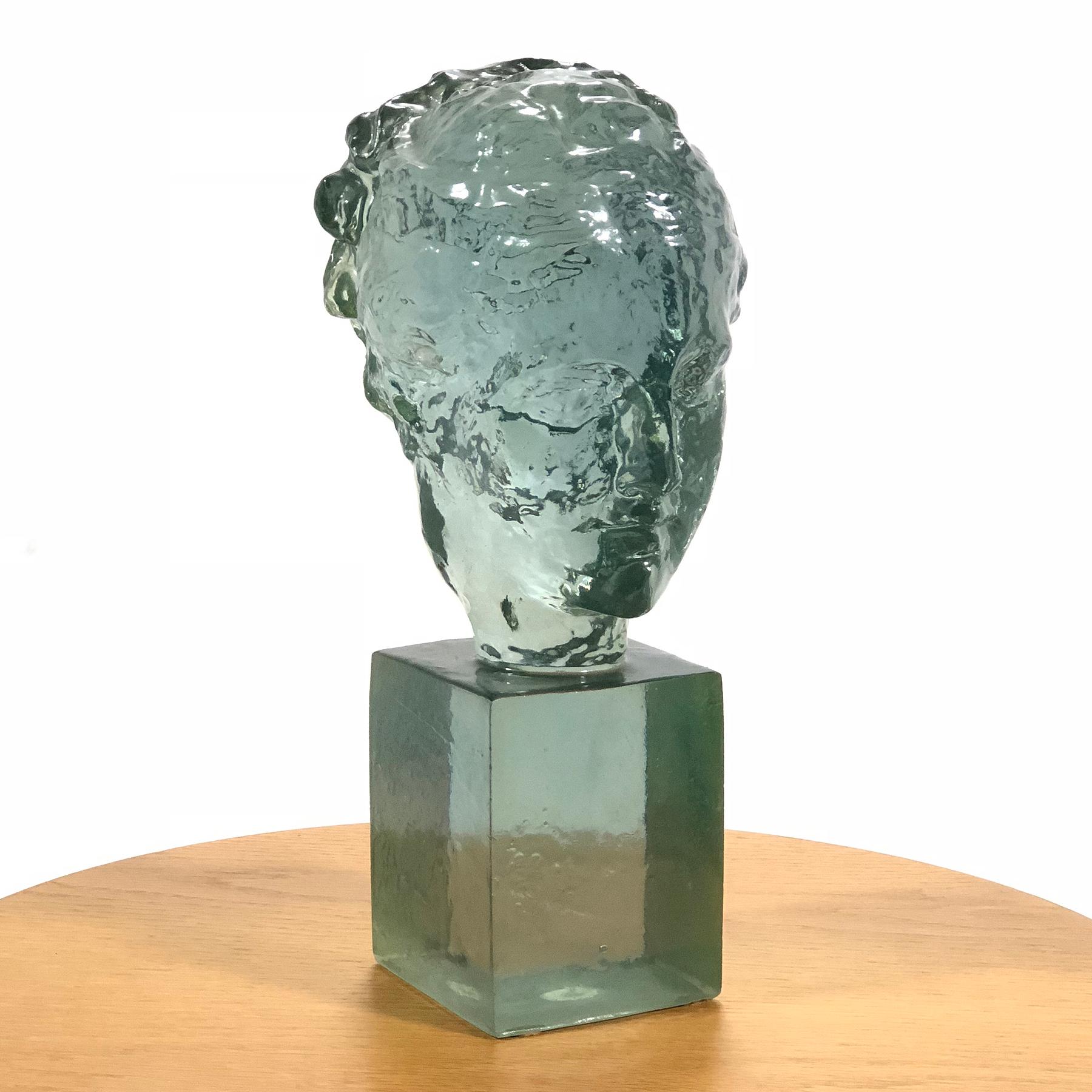 This lovely cast acrylic sculpture of a woman by Dorothy Thorpe has delicate details and a light, luminous quality.