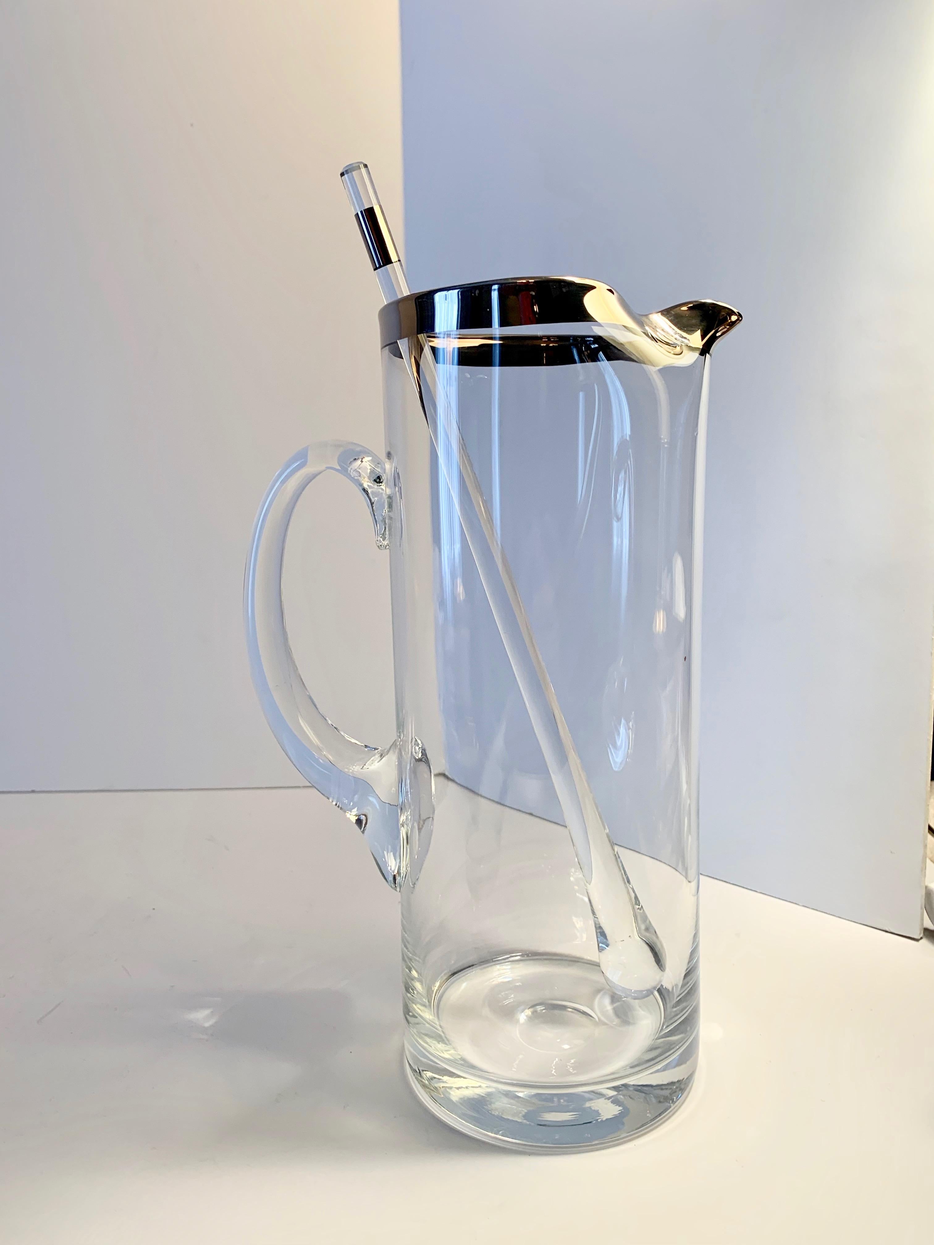 Dorothy Thorpe cocktail pitcher with stirrer - The silver rimmed pitcher and matching silver rimmed stirrer are the perfect companion for the sophisticated bar!

The stirrer is 11.5