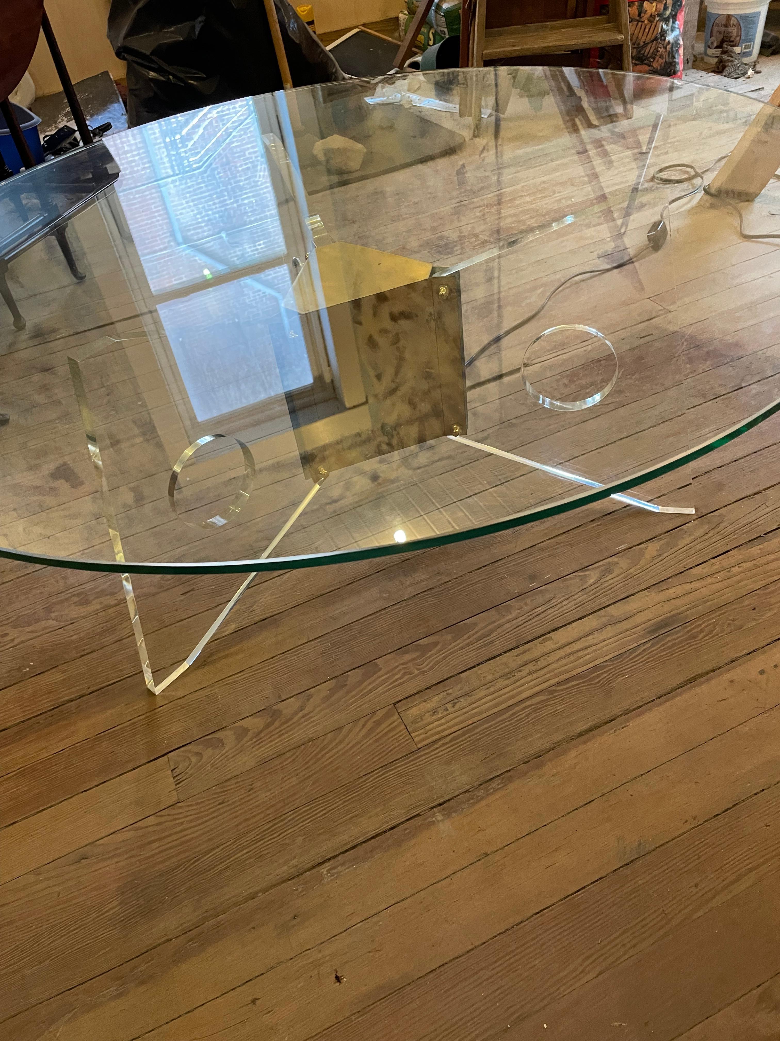 This is a coool coffee table! It has a Lucite base with circle cut-outs which has a bulb in the center brass case. The bulb that came in it is red and the red light seems to radiate from the Lucite legs. The bulb is easy to change and I replaced it