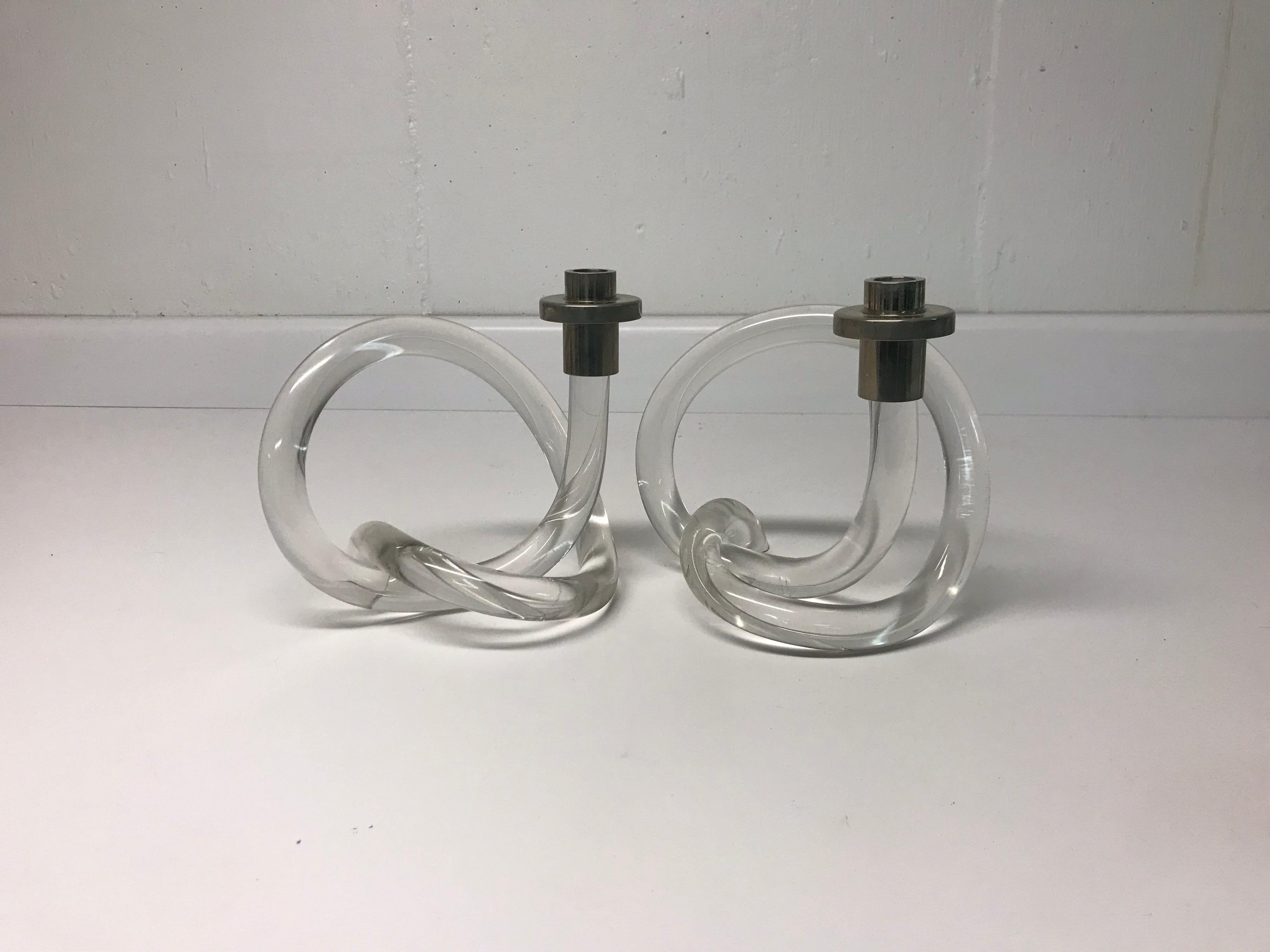 This is a pair of vintage Lucite and chrome pretzyl shaped candlesticks.
The designer of these candlesticks was Dorothy Thorpe in the 1960s-1970s.