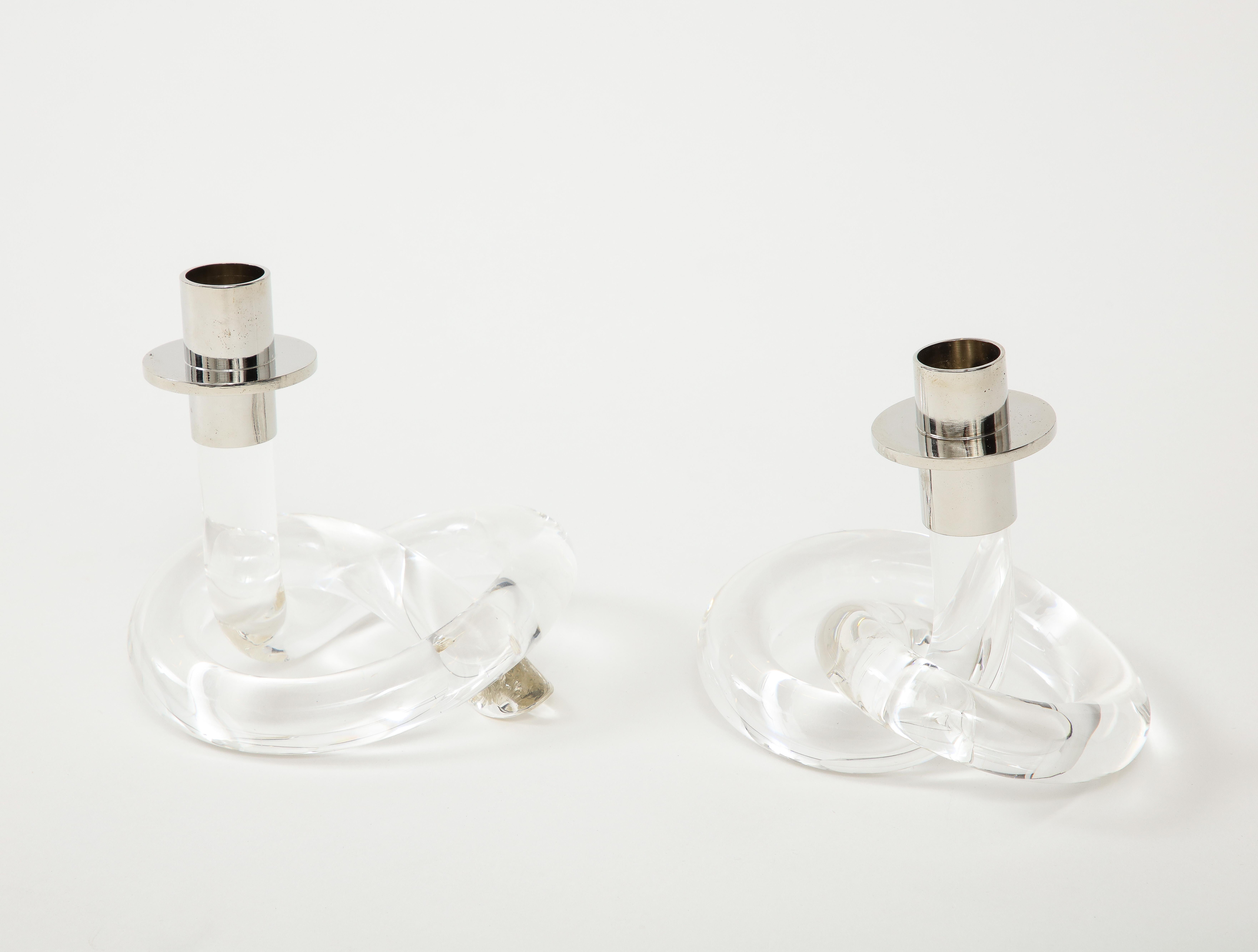Pair of modernist Dorothy Thorpe lucite knot candlesticks perfect for any modern or traditional decor. Currently 3 pairs available.