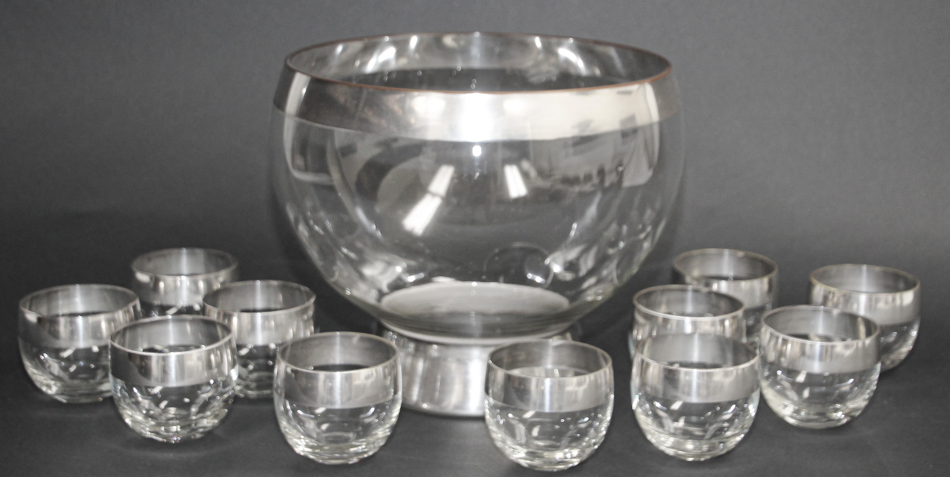 Midcentury Dorothy Thorpe style silver rimmed punch bowl and roly poly glasses, set of twelve
Vintage 1960s attributed to Dorothy Thorpe midcentury barware set of 11 glasses and one punch bowl.
Elegant exquisite vintage 1950s Designer Dorothy Thorpe