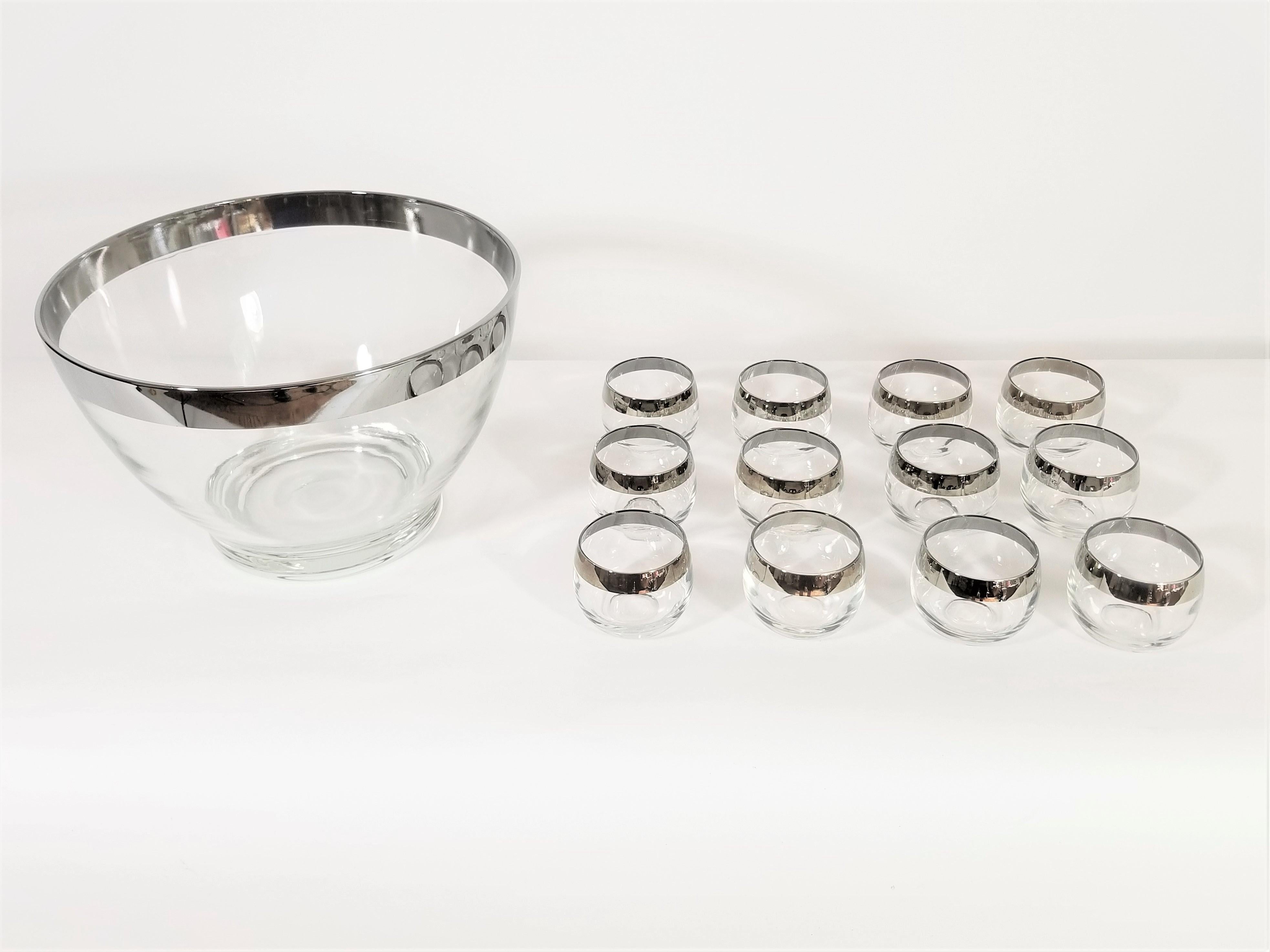 Midcentury Dorothy Thorpe punch bowl set. Silver rimmed. Includes 1 punch bowl and 12 Roly Poly glasses. Excellent condition.
Measurements:
Punch bowl height 7.0 inches x diameter 11.0 inches
Roly poly glasses height 2.25 inches x diameter 3.0