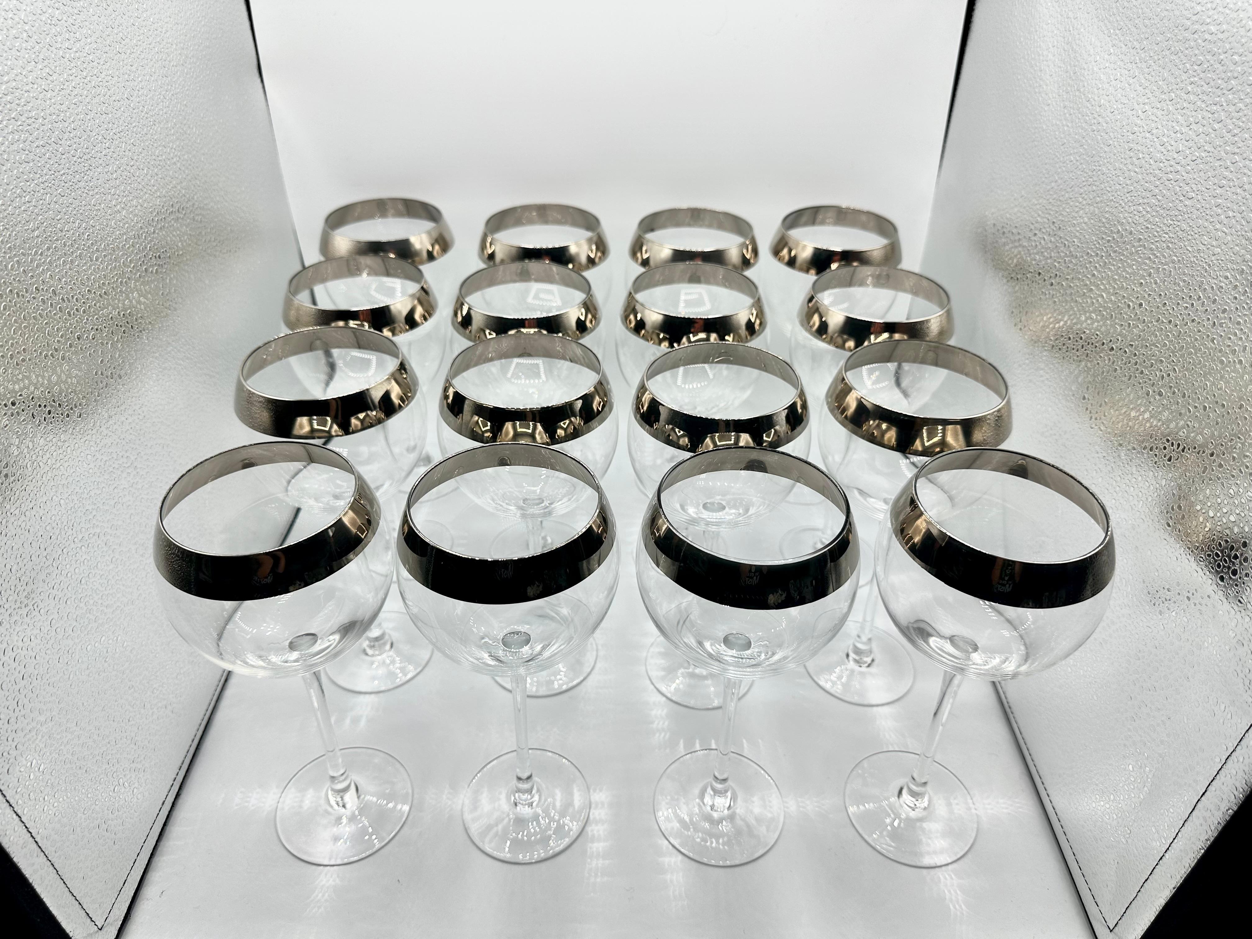 Stunning Set of 16 Dorothy Thorpe Platinum Rimmed Goblet Wine Glasses! Perfect for entertaining or any wine lover, these mid-century modernism style glasses are crafted from high-quality glass and feature a beautiful platinum thick band rim. These