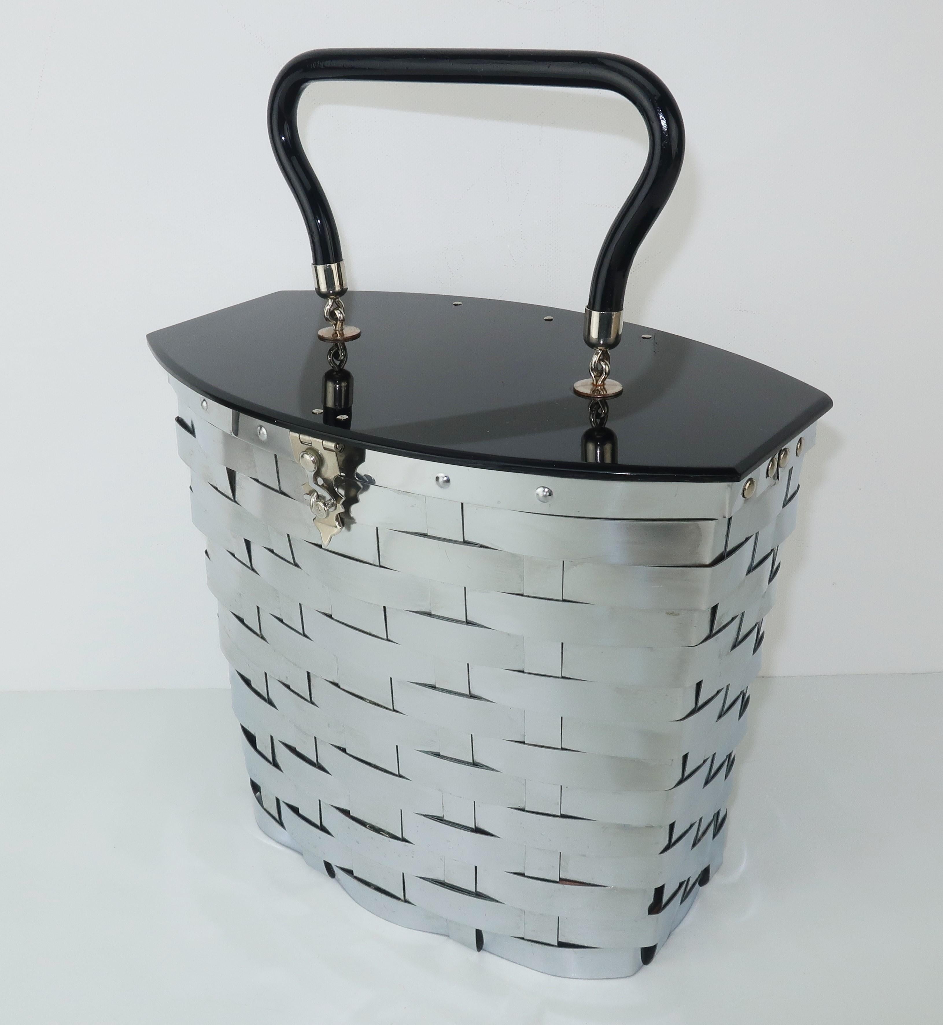 A tisket a tasket ... a fabulous Dorset Rex basket!  In the 1950’s two companies specializing in powder compacts merged to create Dorset Rex Fifth Avenue and began designing fun handbags with a combination of metal and plastics.  This bag has a