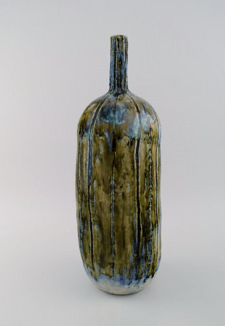 Dorte Sandal (b. 1955), Denmark. 
Large unique vase in glazed stoneware. Beautiful glaze in blue-green and light earth tones with incised vertical lines. 
21st century.
Measures: 40.5 x 14 cm.
In excellent condition.
Signed.