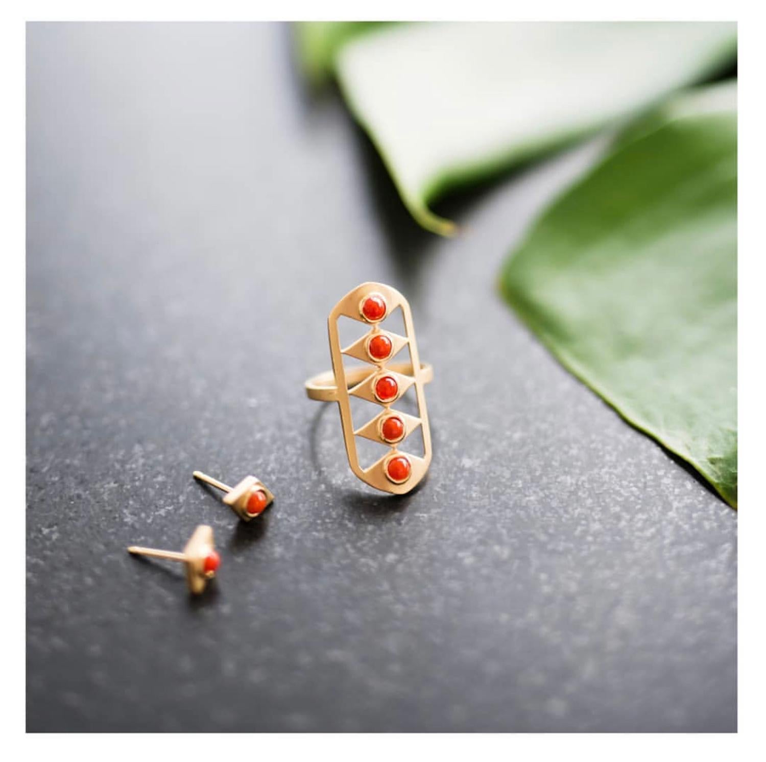 The Kite stud earrings, by Doryn Wallach, feature antique red coral, in 18K yellow gold with satin finish.  They add a subtle pop of color and Art Deco styling to any look. 

The price shown is reduced by 40% from the original.