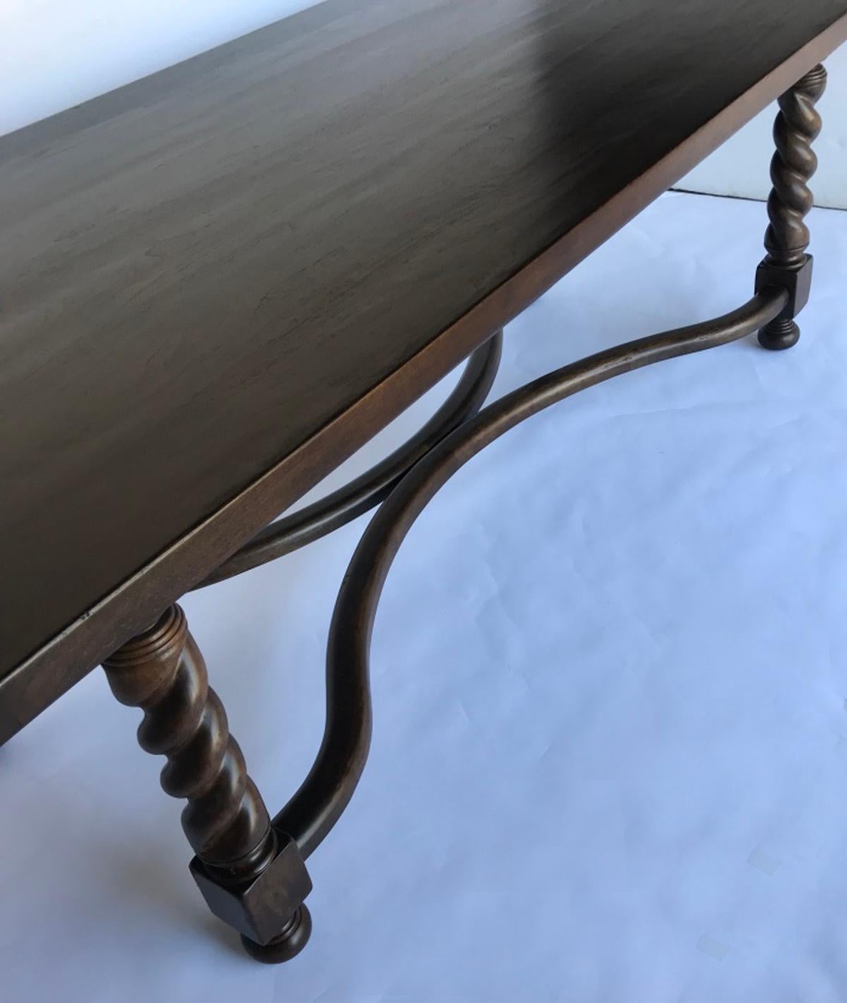 Custom walnut barley twist leg table with a curved stretcher. As shown here in walnut #2 with a light distress. Two breadboards on each end finish the table and gives it a traditional look. Can be made in any size and in a variety of finishes. Bench