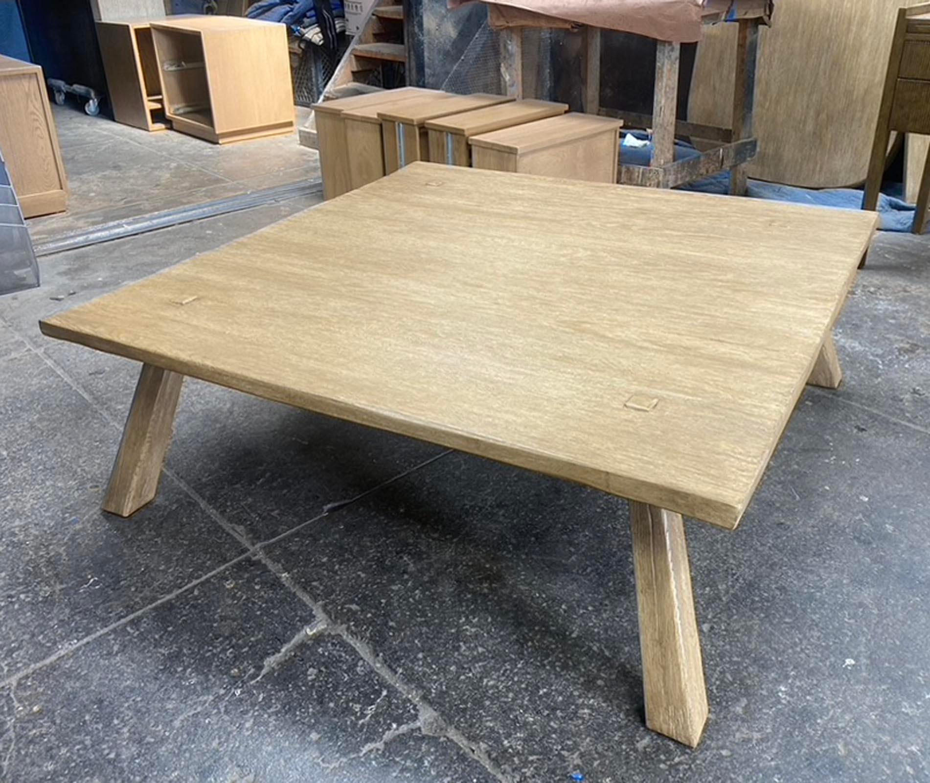 This is our custom rustic coffee table in solid cathedral oak with a heavy distress and Light Latte finish. The hand planed surface add interest and intentional cracking of boards and soft rounded edges give a warm and worn look. Legs are set in