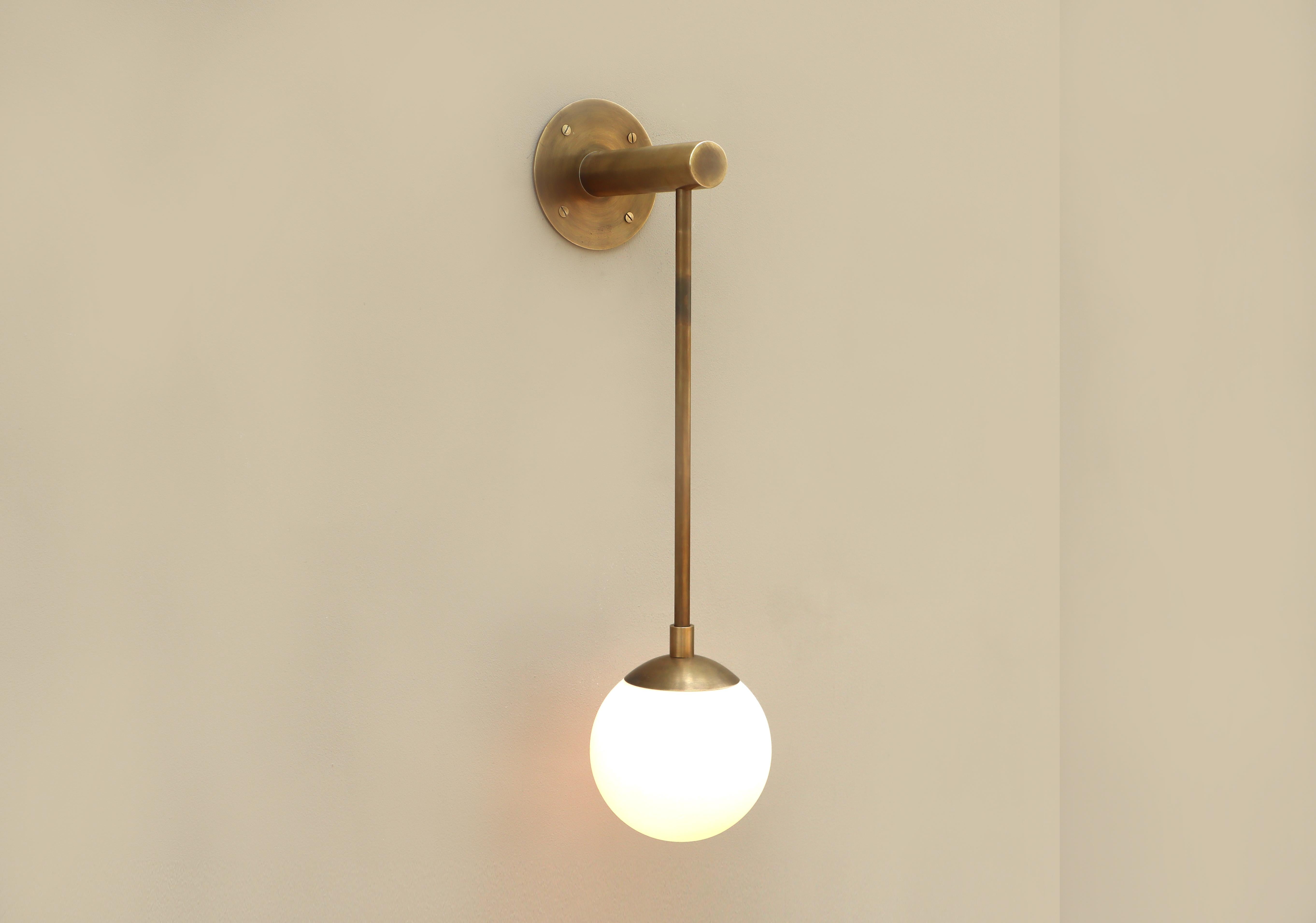 Dot Long Glass Globe Wall Sconce by Lamp Shaper
Dimensions: D 15 x W 19 x H 63.5 cm.
Materials: Brass and glass.

Different finishes available: raw brass, aged brass, burnt brass and brushed brass Please contact us.

All our lamps can be wired