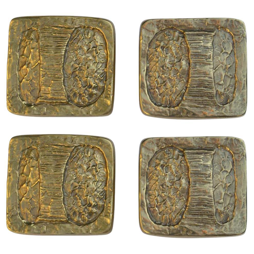 A set of two artistic Brutalist bronze door handles with abstract textured design. They have a bright patina protected with a coating against wear. European 1970's with the original Alpan box and never been used. They give real personality to a