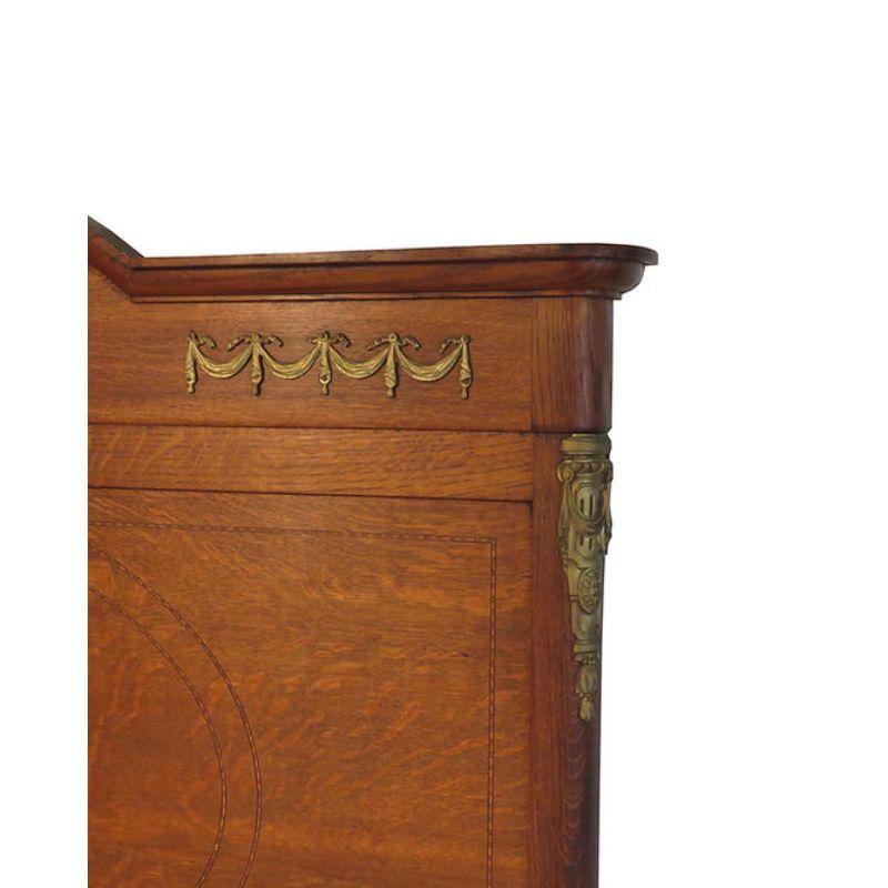 Double - 4'6 wide, beautiful antique French Oak bedstead with a curved foot end and very high headboard. The bed has lovely marquetry and brass ormolu mounts on the sides and in the style of Louis XV1.

Comes complete with a superior firm bed base. 
