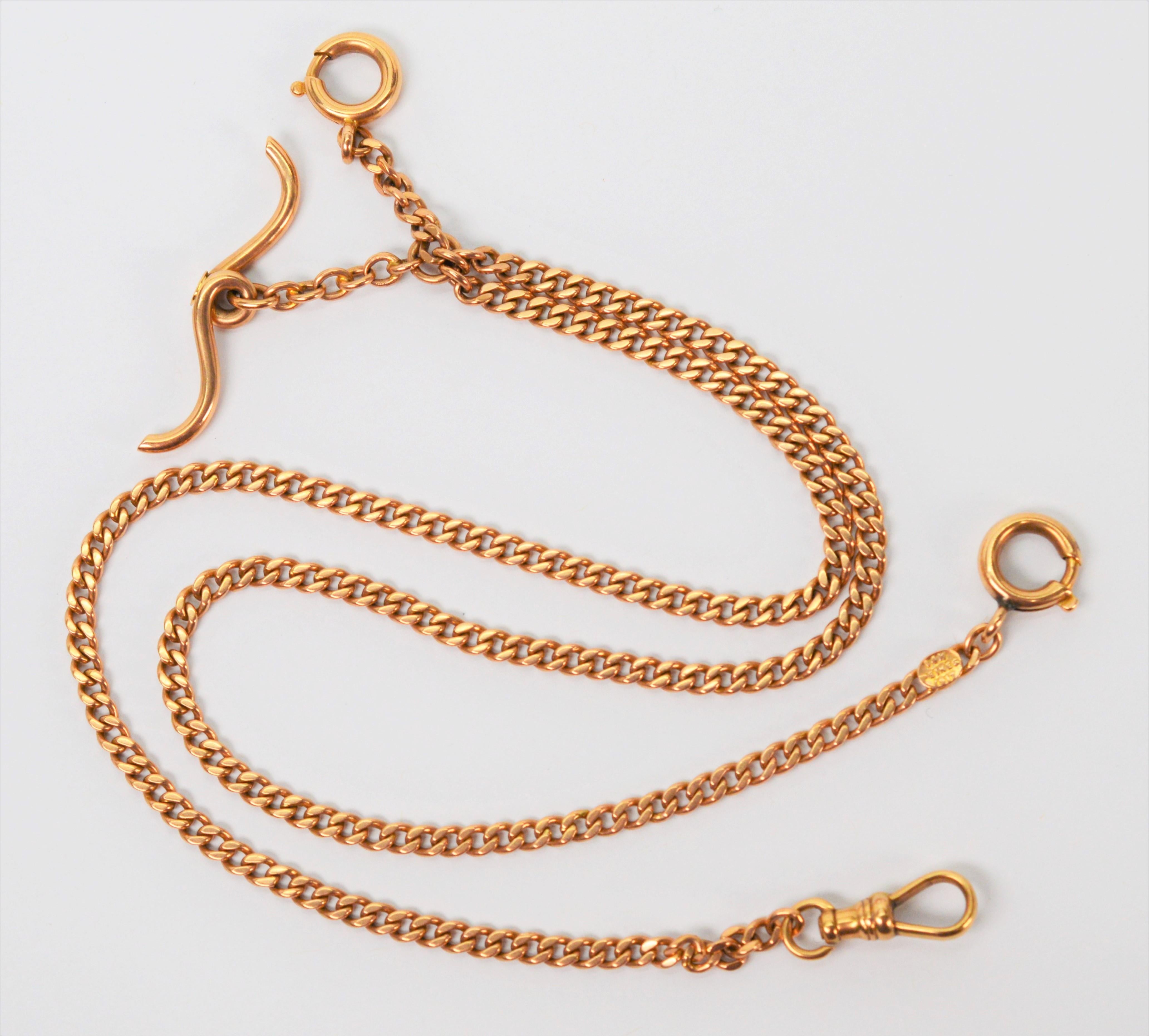 In fourteen karat 14k yellow gold, this 20 inch double Albert Watch chain has two twenty inch chains off the T bar, with one intended for your favorite pocket watch and the other possibly intended for your keys. On this antique piece, there is a