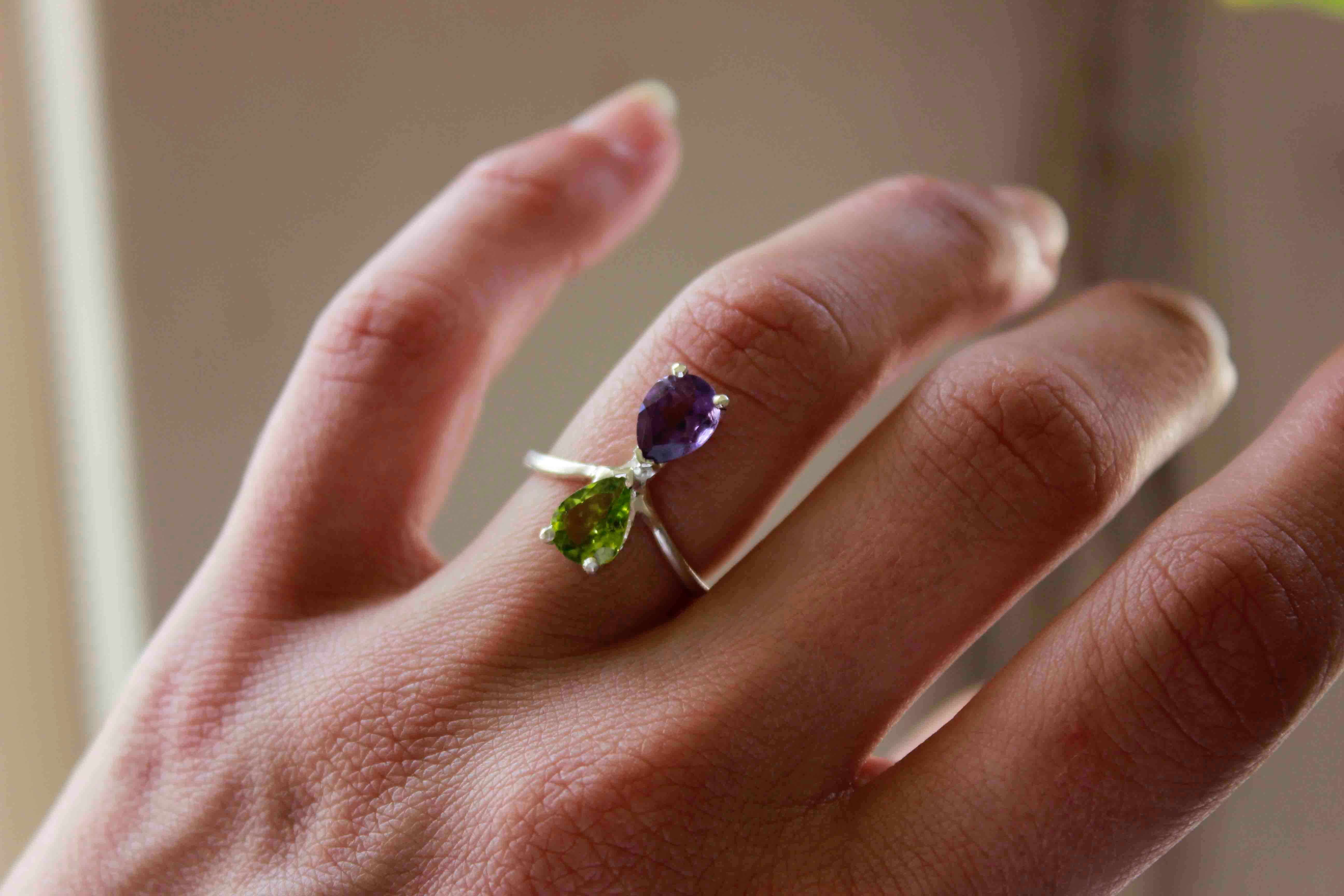 Double Amethyst and Peridot Ring

A magical silver ring featuring two stones, an amethyst and a peridot.

This is perfect statement ring to complete your summer outfits.

Stones size 6×8 mm

Your ring will be made to order in your size,