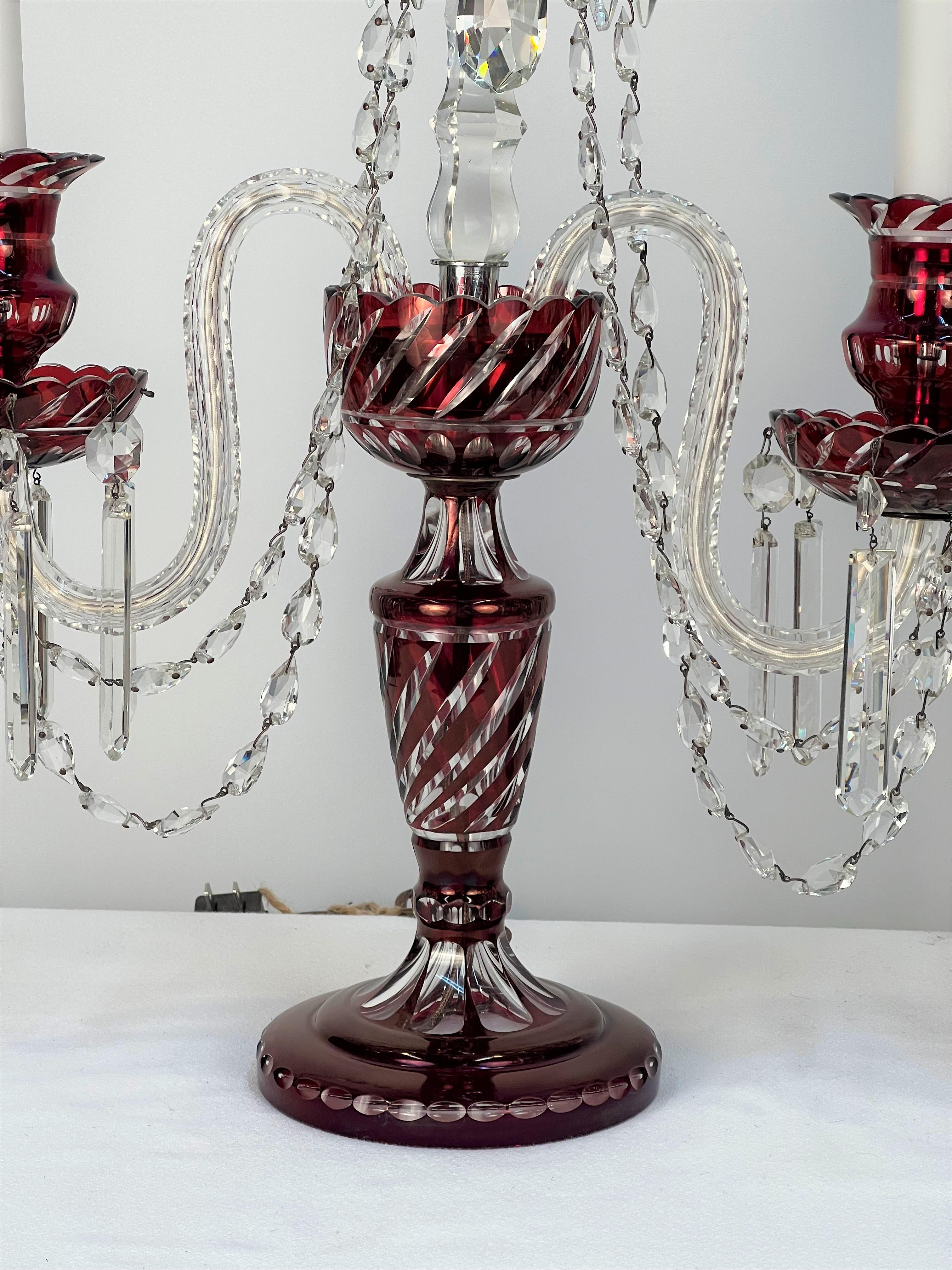 A beautiful pair of Bohemian Girandoles (Candelabrums) with Cranberry & Clear Crystal made in the in 
 country of Czechoslovakia.
There are no cracks, breaks or repairs to the glass.
Please note that the candelabrums will ship partially