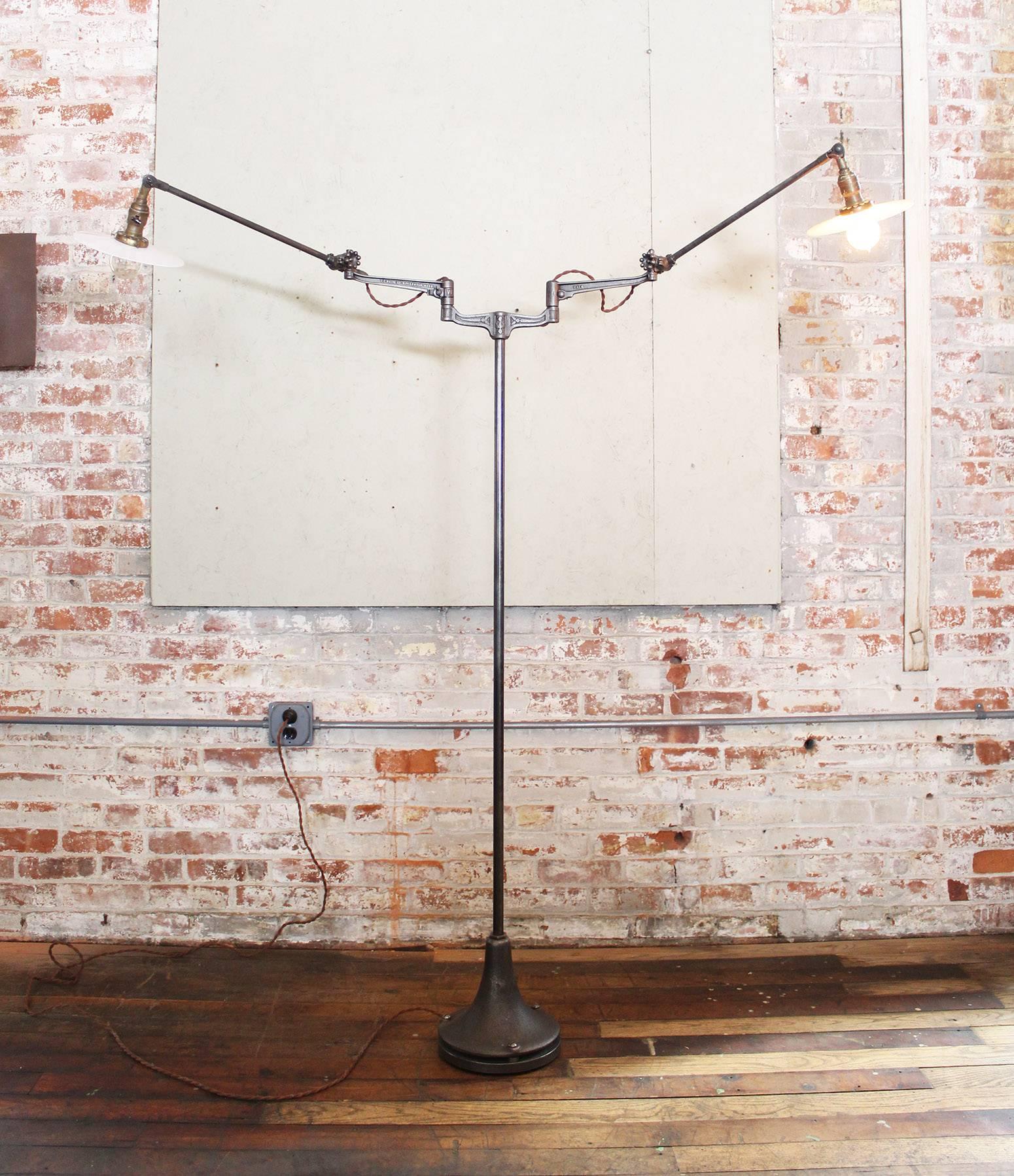 Adjustable double-arm machine task lamp with milk-glass shades and cast-iron O.C. White parts. Base measures 9 1/2