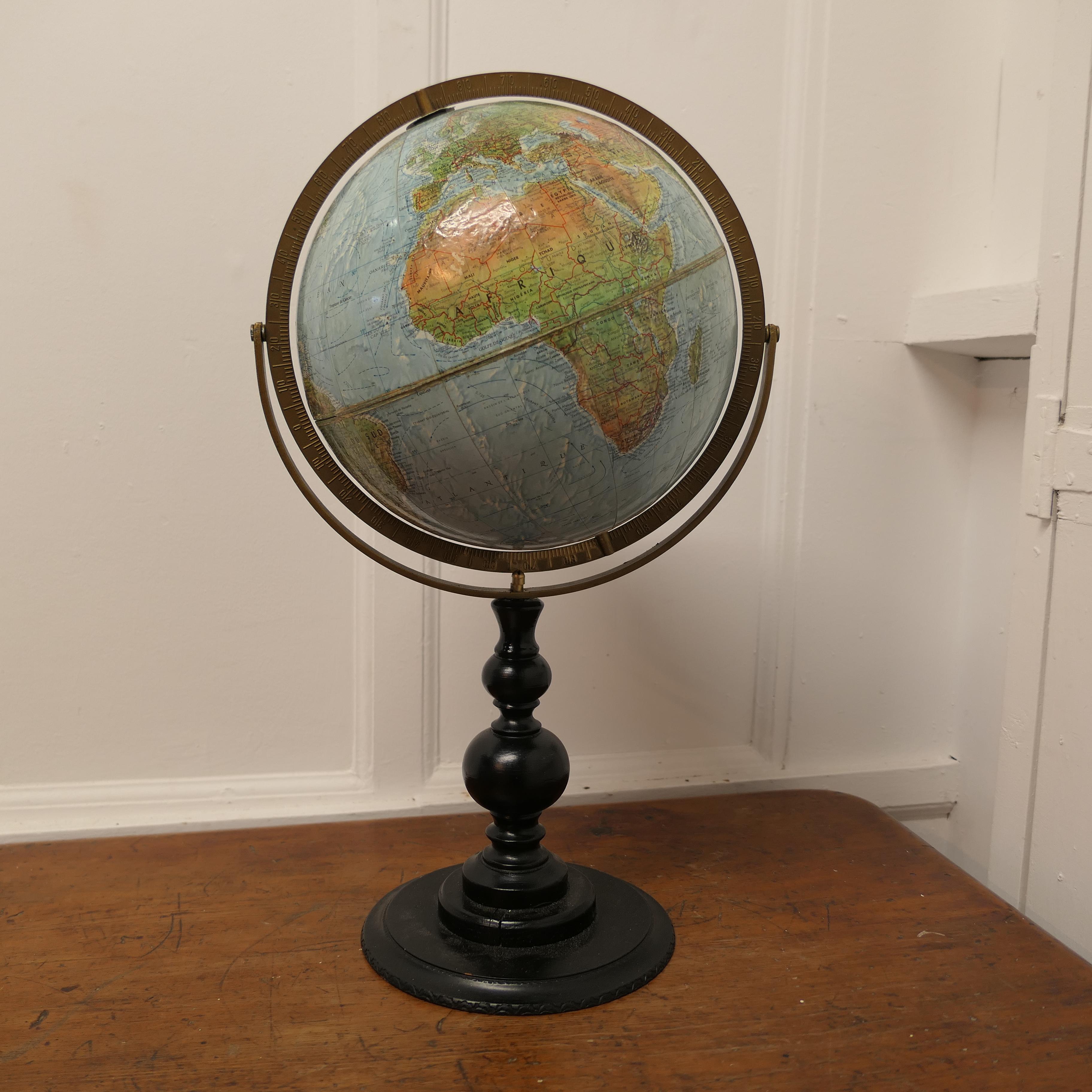 Double Axis Scan Globe A/S with Raised Topography
A good quality Desk Scan Globe A/S (©Replogle Chicago, Hassing Kopenhagen Corporation) in Denmark, with a double axis, rotating protractors and relief raised map surface. The globe is set on a turned