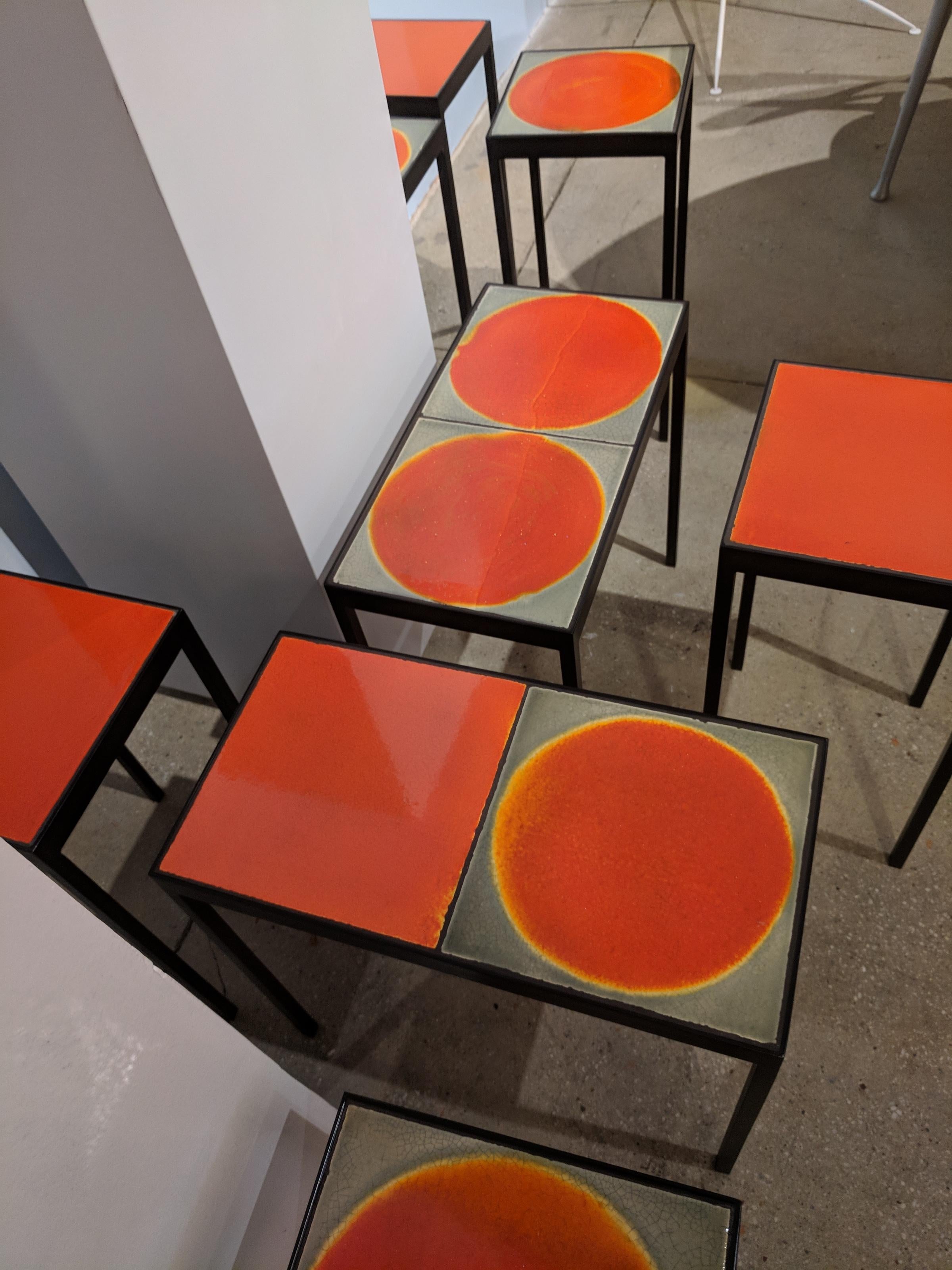 These tables are feature painted steel frames and a vintage lava tile from Roger Capron. Each tile is unique, hand-glazed and varied in color and texture. 

Custom tables available upon request. Client can pick the tiles used and specify the size