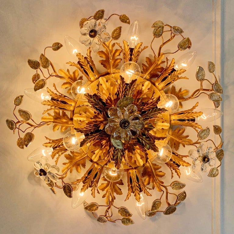 A wonderfully rare Italian Florentine flush mount ceiling light by Banci Firenze, Florence 1960's.

Stunning large gilt acanthus leaf design, with large clear murano glass flowers on fine gilt stems. We have never come across this style of Banci