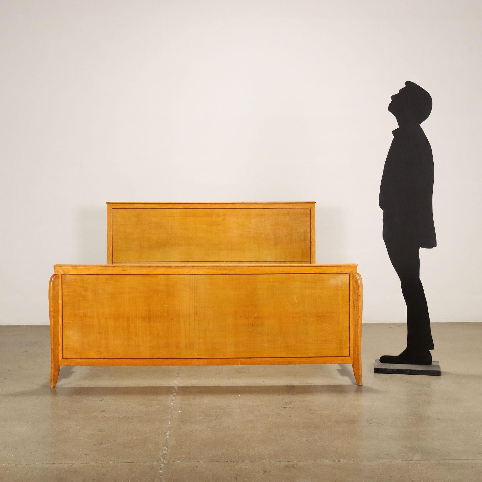 Double bed; maple veneered wood.