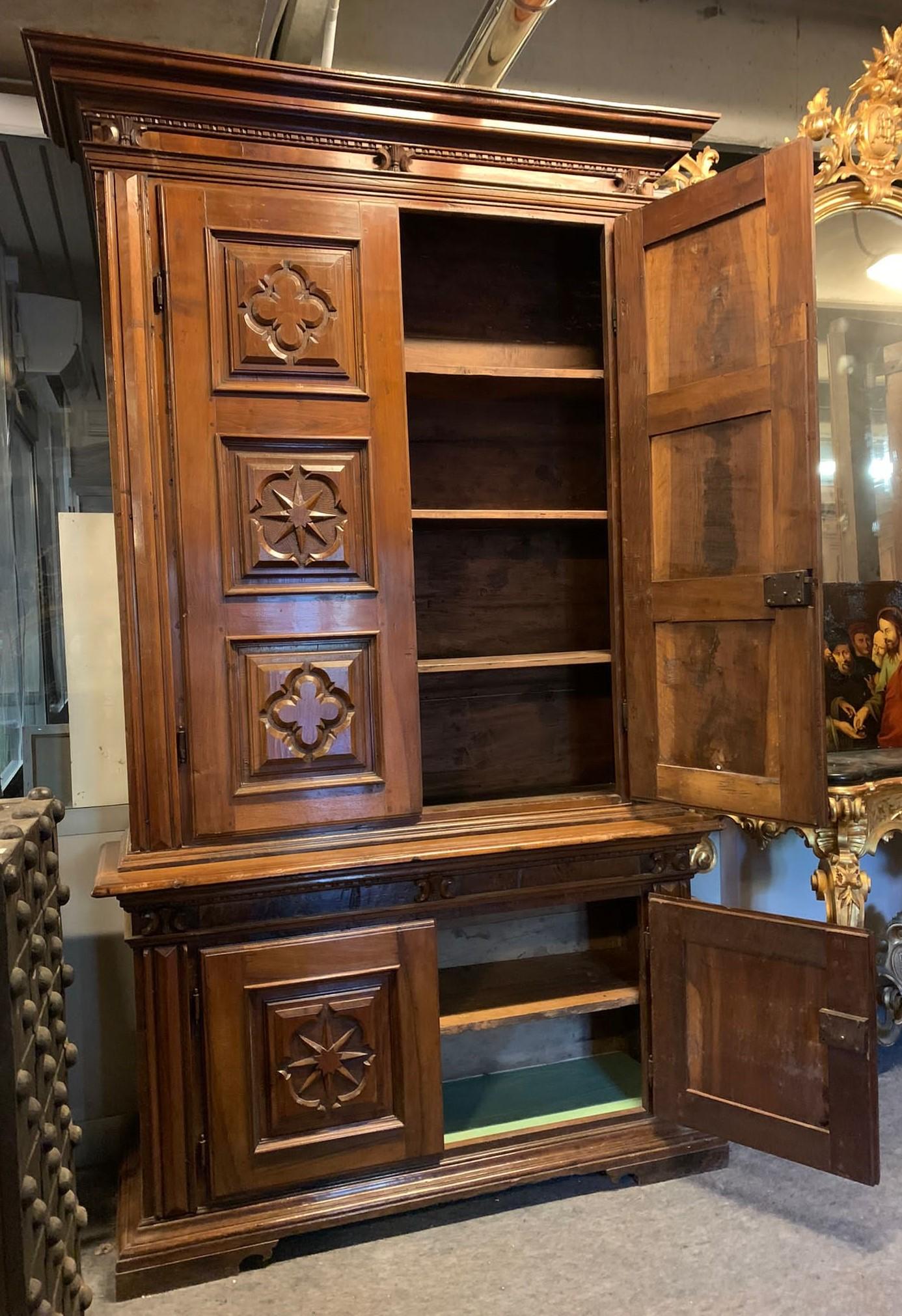 Italian Double-body cabinet in richly carved walnut wood, Tuscany For Sale