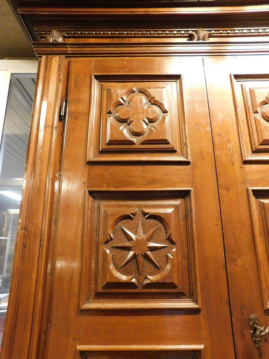 Hand-Carved Double-body cabinet in richly carved walnut wood, Tuscany For Sale